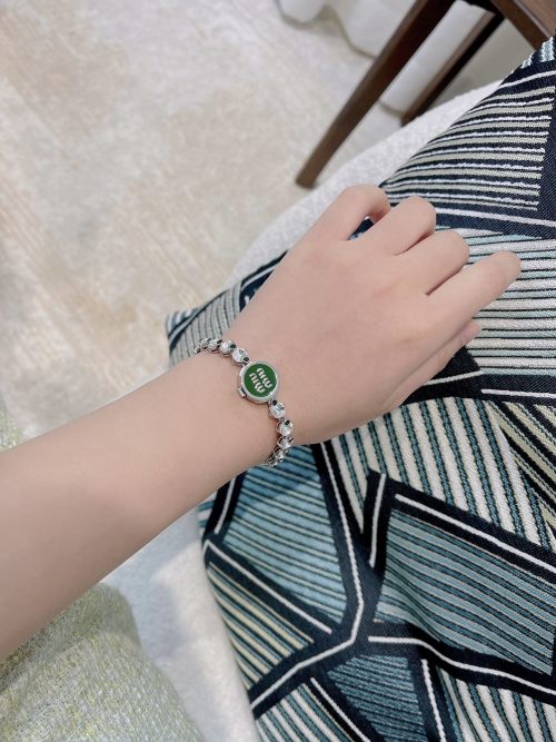 Miu Miu Crystal Logo Bracelet - Green Glass Accents & Sparkling Chain 1 Miu Miu Crystal Logo Bracelet - Green Glass Accents & Sparkling Chain