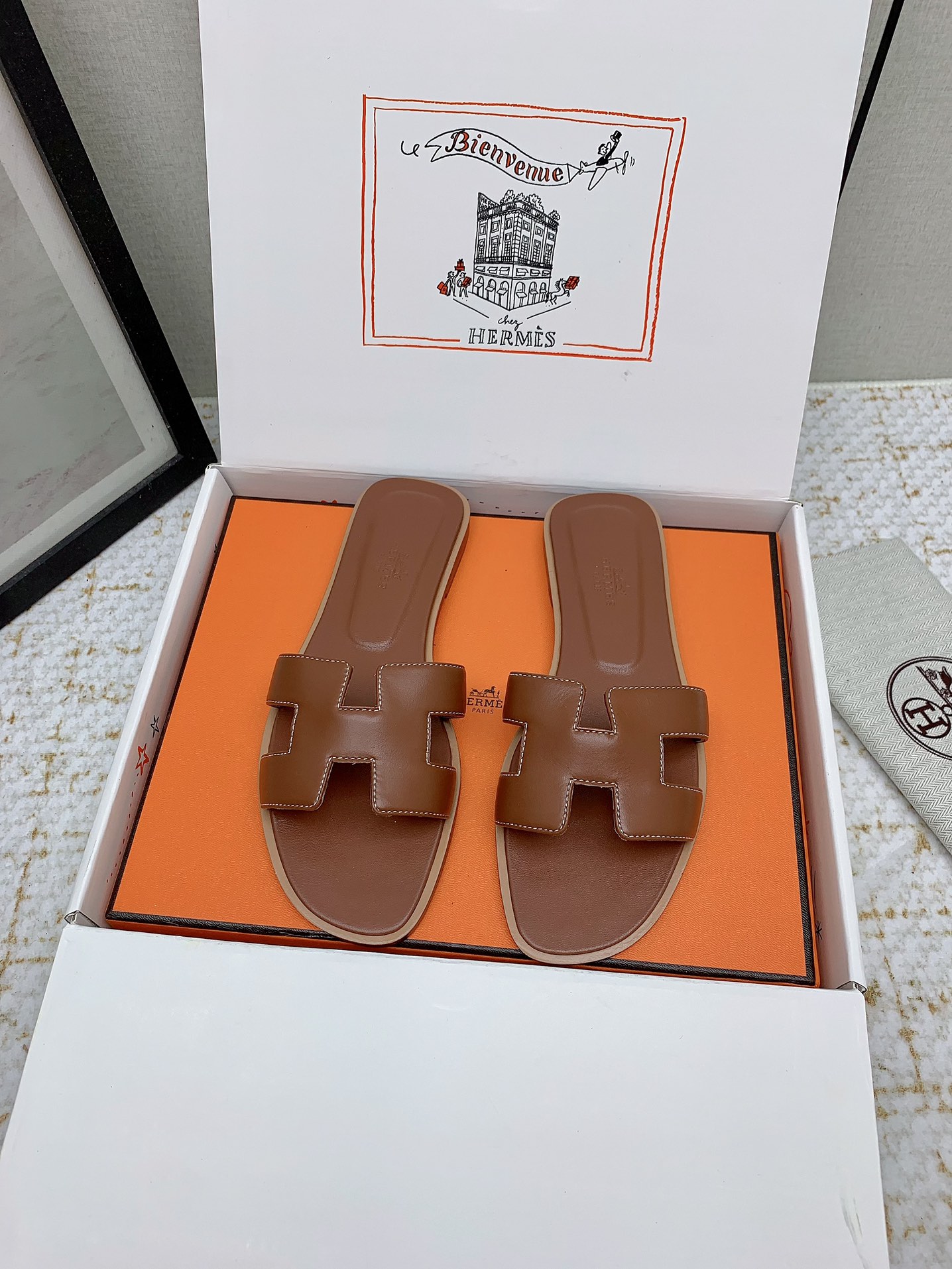 Hermès Oran Leather Slides - Iconic 'H' Cutout Design - Various Sizes Available 2 i1750232846 6971 7