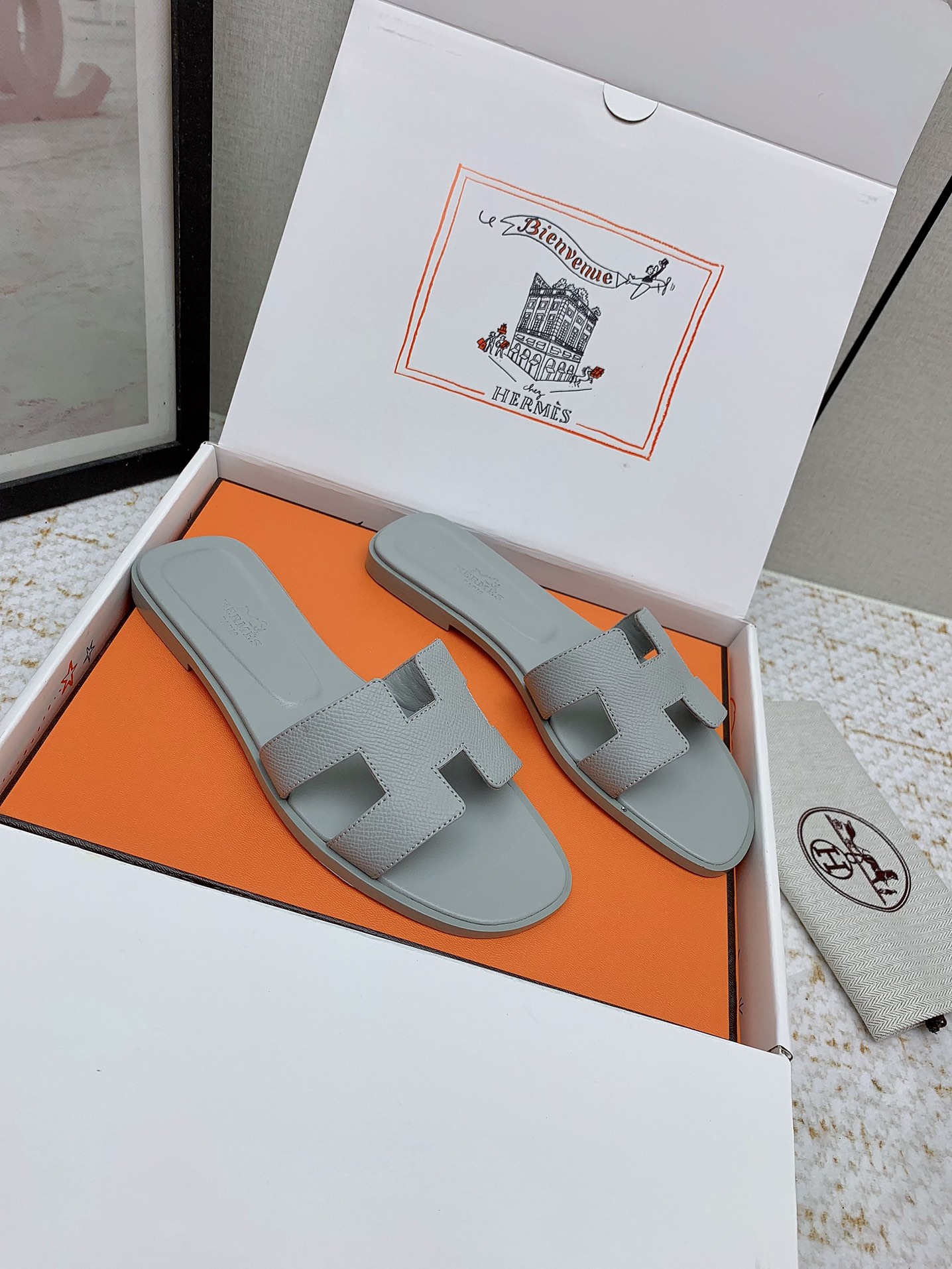 Hermès Oran Sandal, Gray Leather Slides for Women, Sizes 35-42 Available 1 i1750233341 6100 0