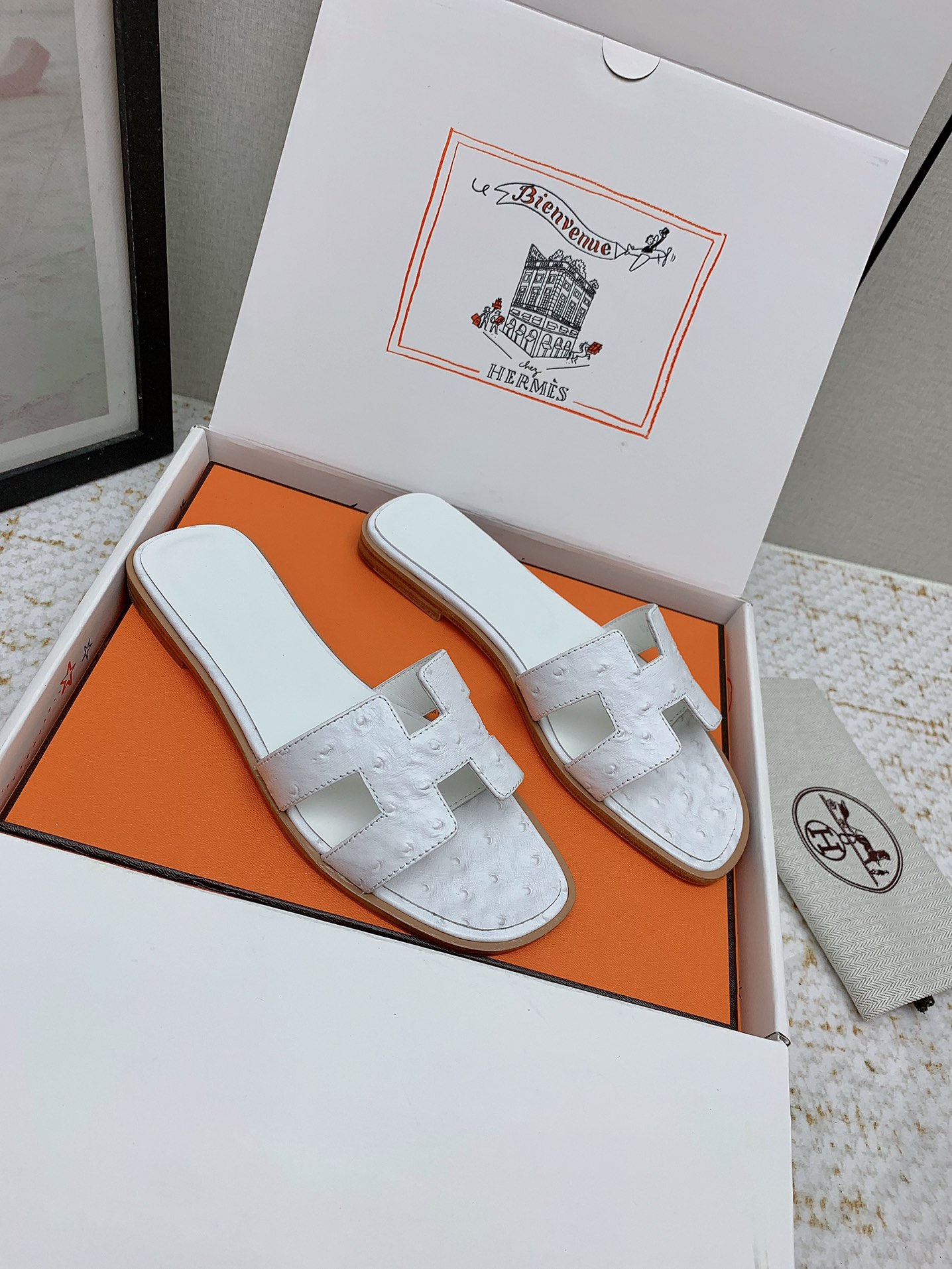 Hermès Oran White Ostrich Leather Sandals Elegant Summer Slides 2 i1750233879 1057 5
