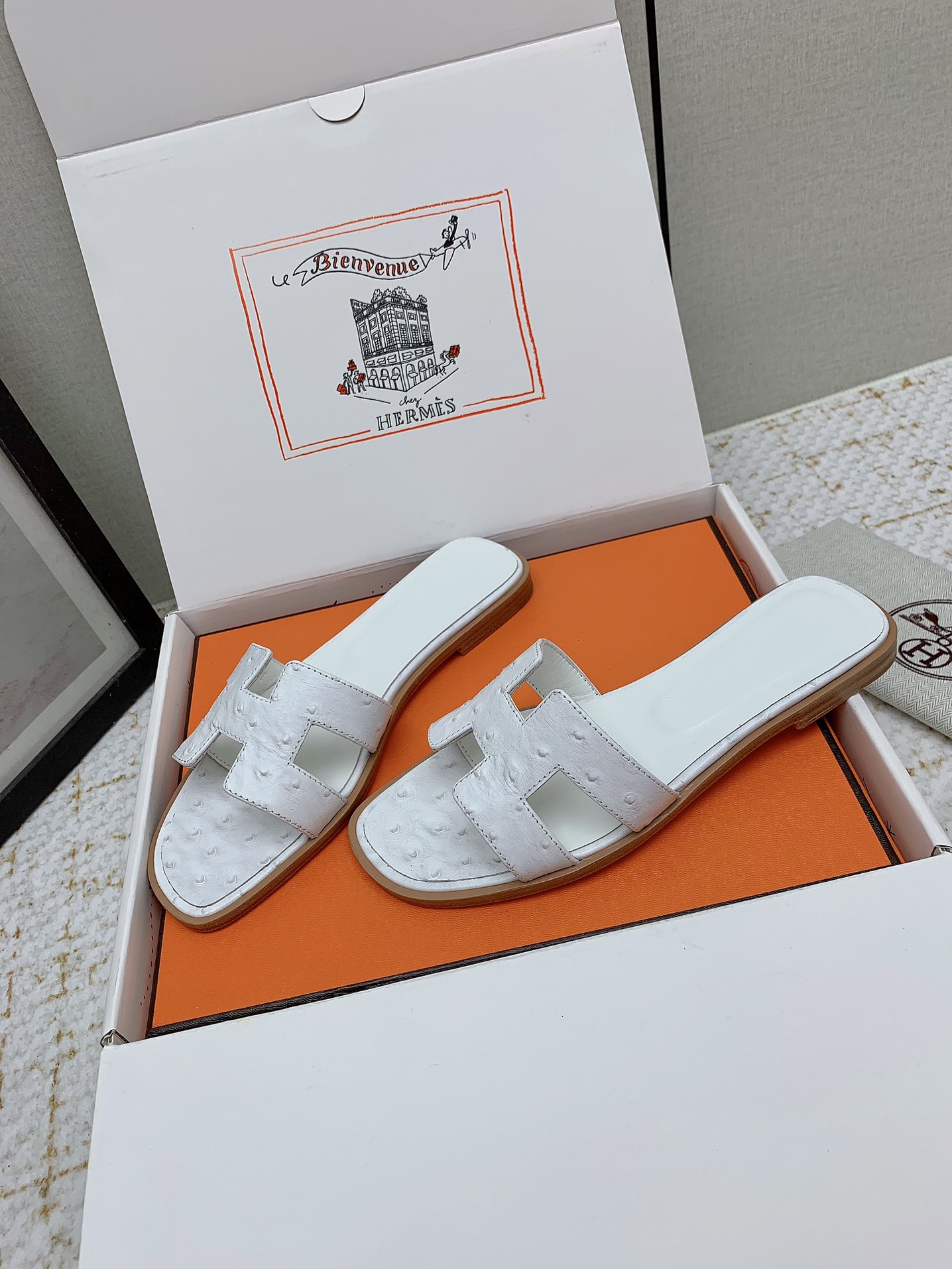Hermès Oran White Ostrich Leather Sandals Elegant Summer Slides 4 i1750233879 1186 8