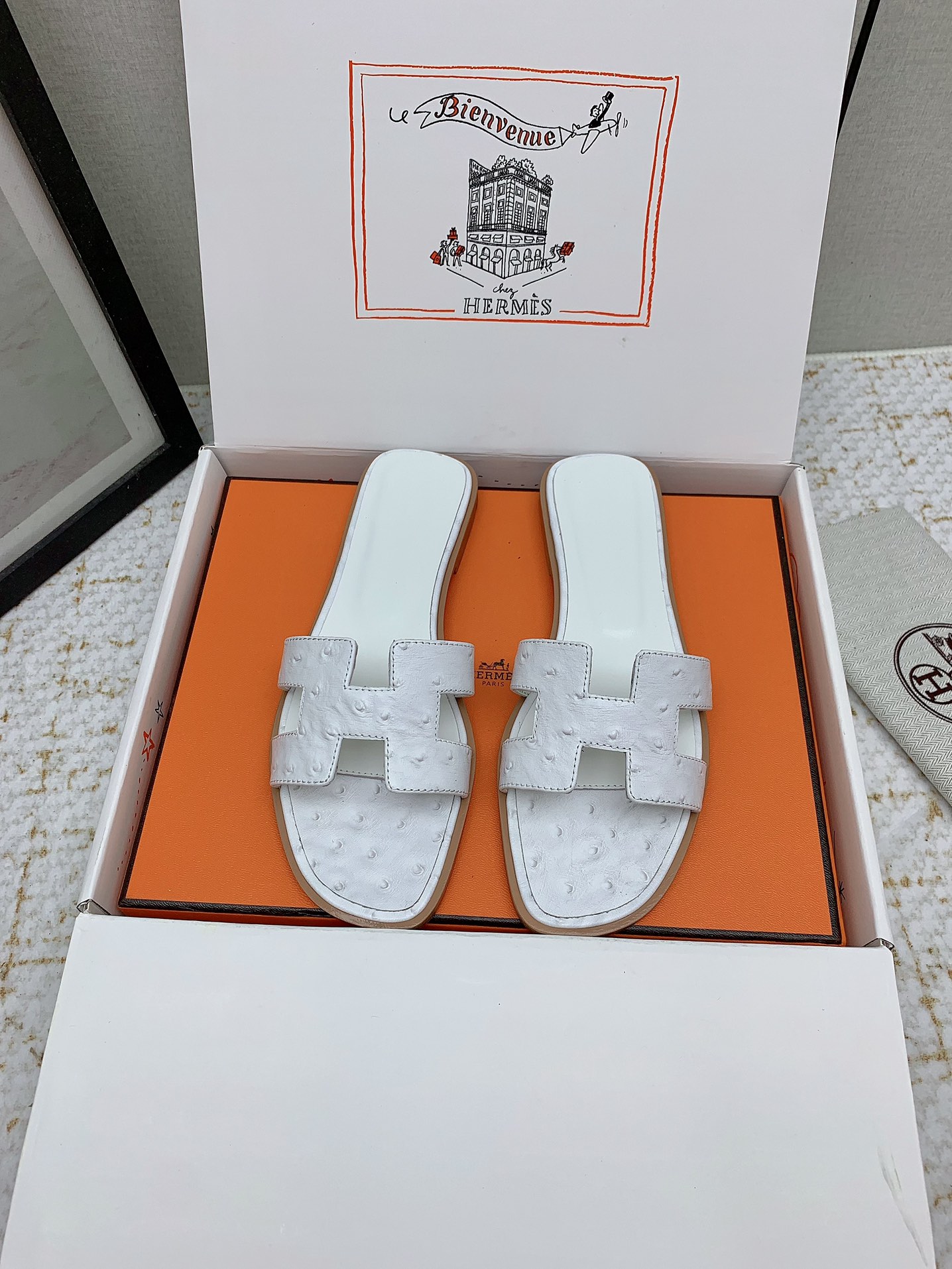 Hermès Oran White Ostrich Leather Sandals Elegant Summer Slides 3 i1750233879 3914 6