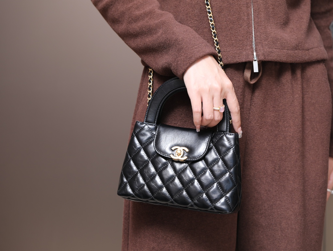 Tuck the shoulder strap away—it looks effortlessly chic carried by hand. - Bag 2