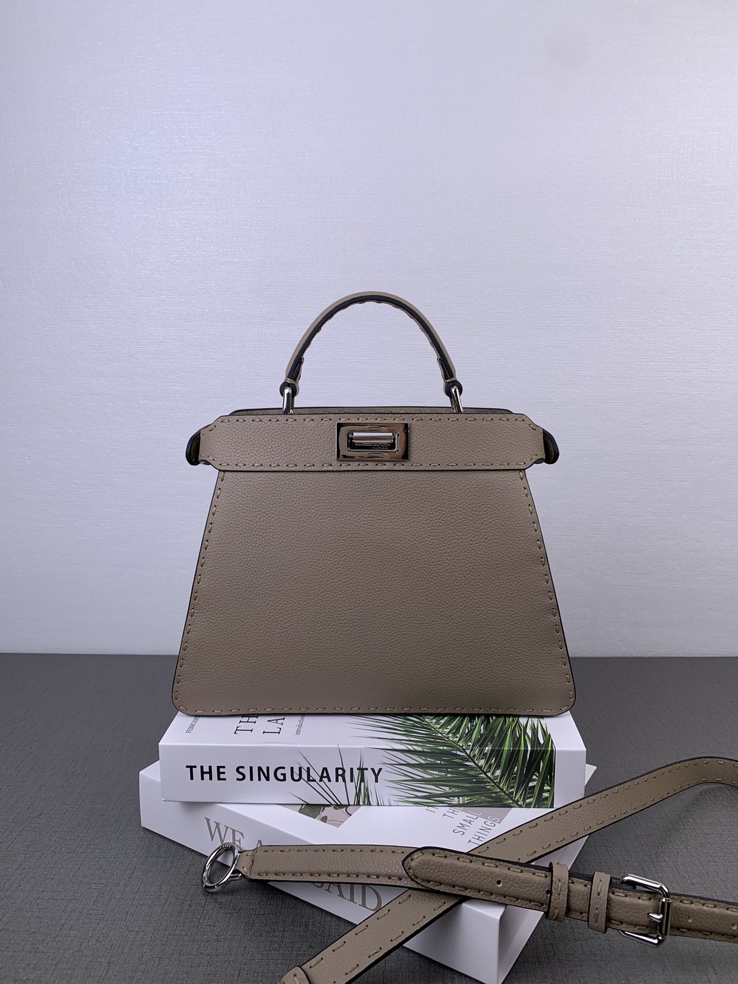 In stock ✔️ New Peekaboo LSEEU mini bag. Sample available at the stall. Color may vary slightly—dove gray. New series in full-grain leather with accordion design. Hand-stitched with waxed thread 🧵, silver metal hardware, full vintage vibe ☘️☘️☘️☘️. Luxurious feel [heart][heart][heart]. Classic and versatile, super stylish 💯. Model 88N328. Size: 27 x 21 x 9.5 cm. image 1
