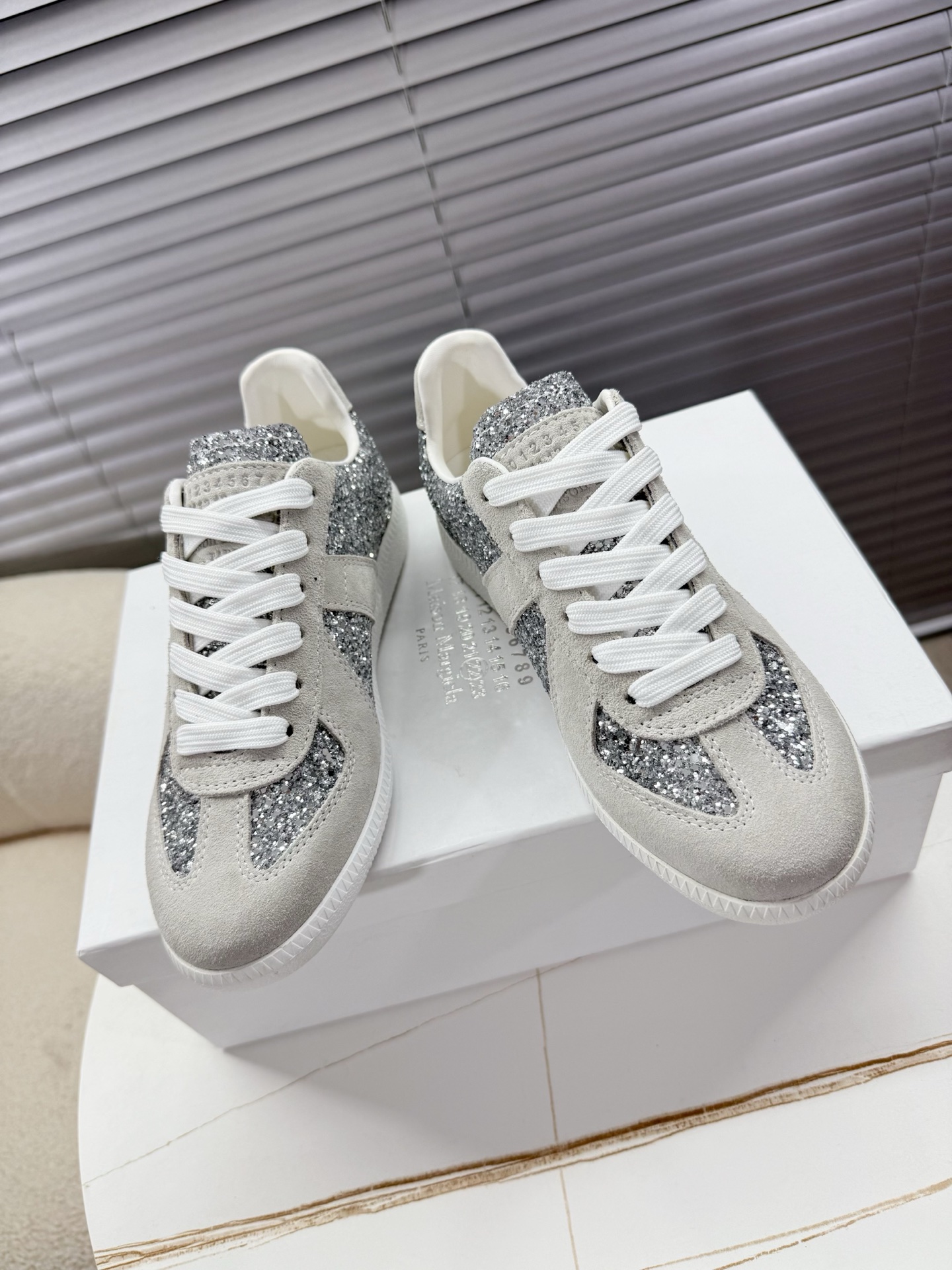 Title: Maison Margiela MM6 Couples’ Shoes Collection Summary Summary: Maison Margiela introduces upgraded MM6 couples’ shoes with sauerkraut skin and silver velvet for women and
