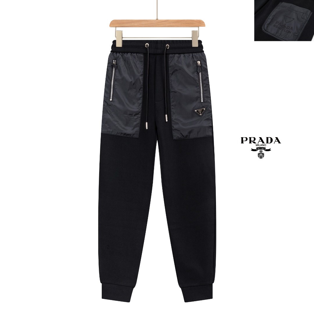 PJN Parda 普拉达25秋季新款裤子 欧洲贸易渠道,意大利海外仓直发,海外精品限定销售. 25SS新款休闲时尚卫裤,这款卫裤采用大牌的设计打造时尚潮流感,细节处理精致到位,展现超高的品质. 裤身上点缀标志性品牌标识,彰显品牌格调,打造时尚多样的造型.100%进口面料精心打造,柔软舒适,还亲肤保暖,是居家和外出都很舒适的一款裤子,随便搭个外套卫衣就可以出门啦~ 颜色:黑色