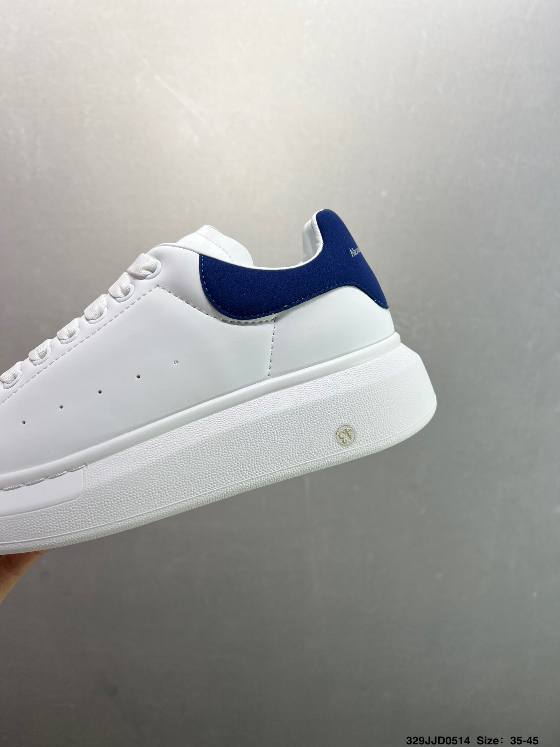 Alexander McQueen Oversized White Leather Sneakers with Blue Heel Tab 7 i1747147616974 6081 0 5
