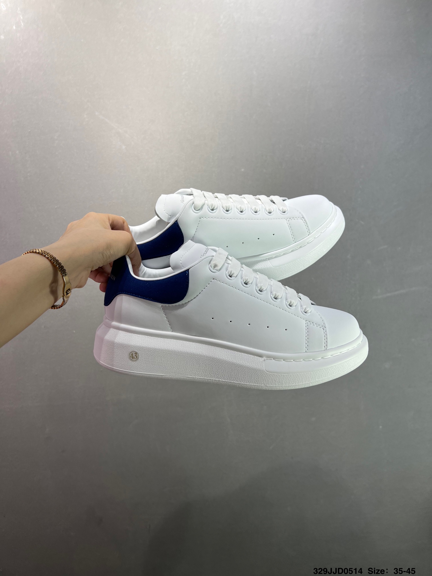 Alexander McQueen Oversized White Leather Sneakers with Blue Heel Tab 10 i1747147616986 3651 0 8