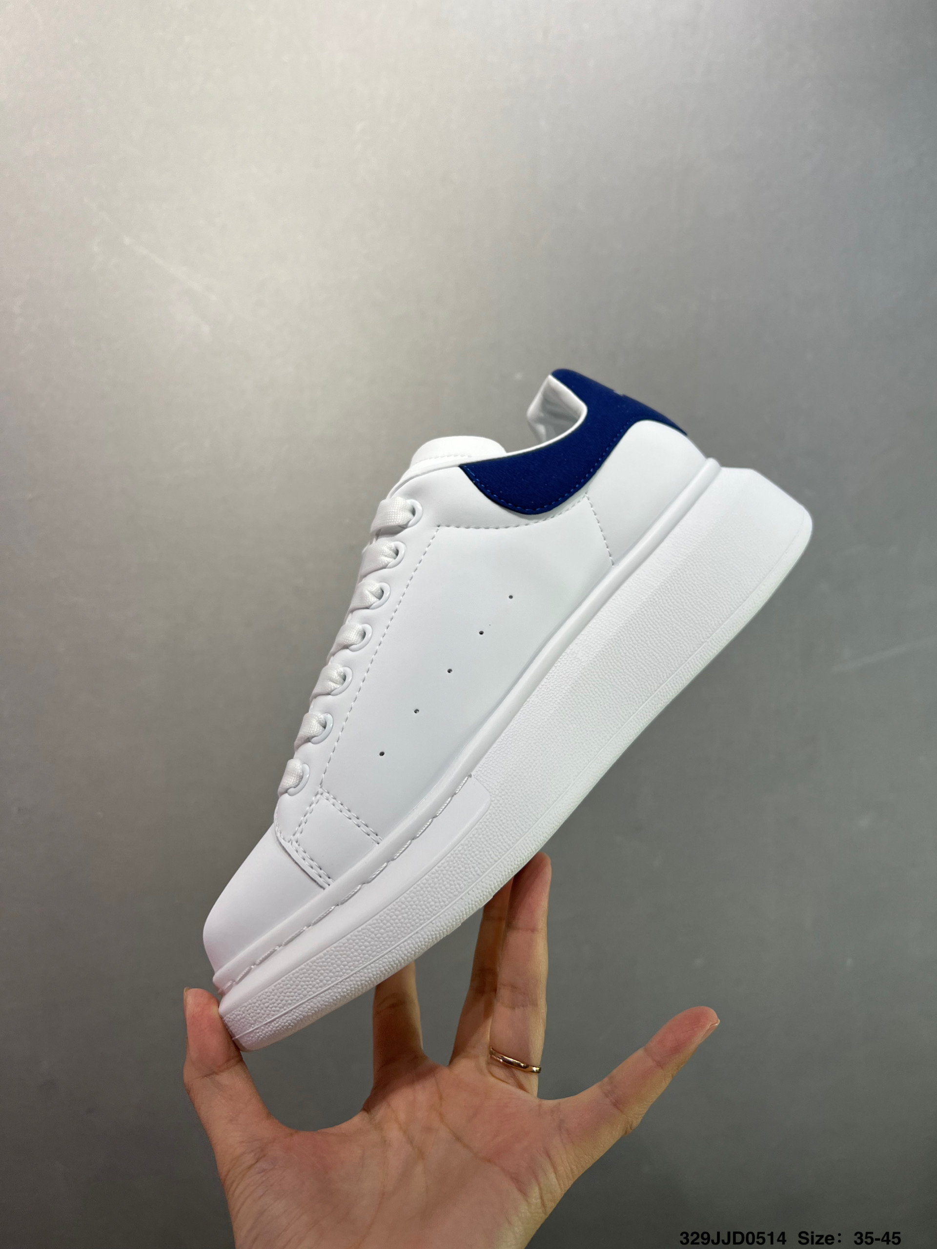 Alexander McQueen Oversized White Leather Sneakers with Blue Heel Tab 4 i1747147618083 7948 0 2