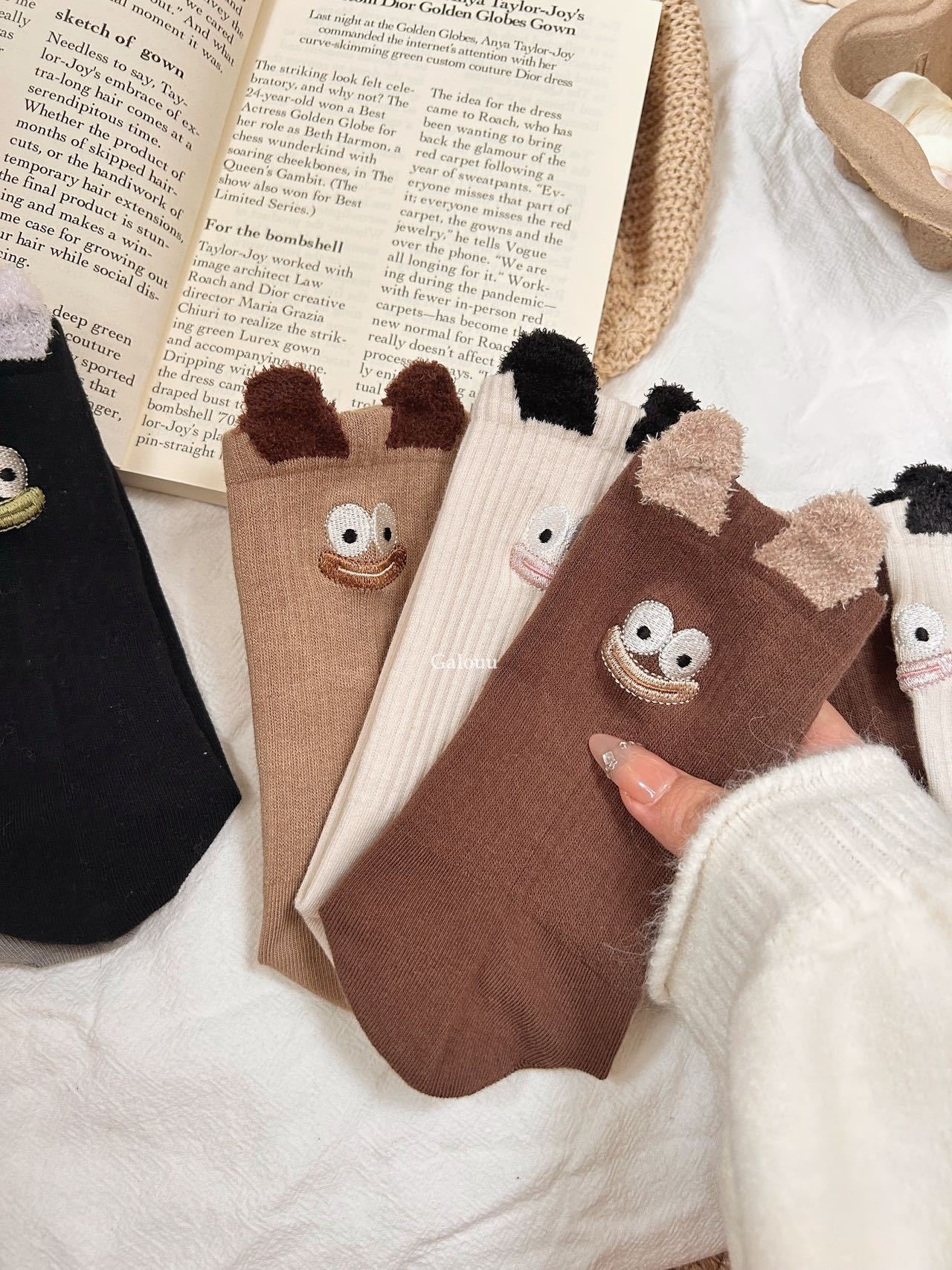 Detail View: Novelty socks featuring an embroidered expression motif at - Comprehensive 2