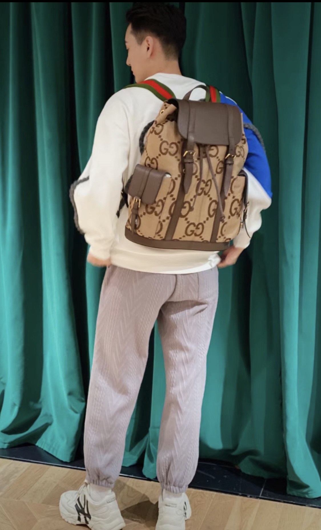 Gucci backpack has a high-end feel with a "dark" color.