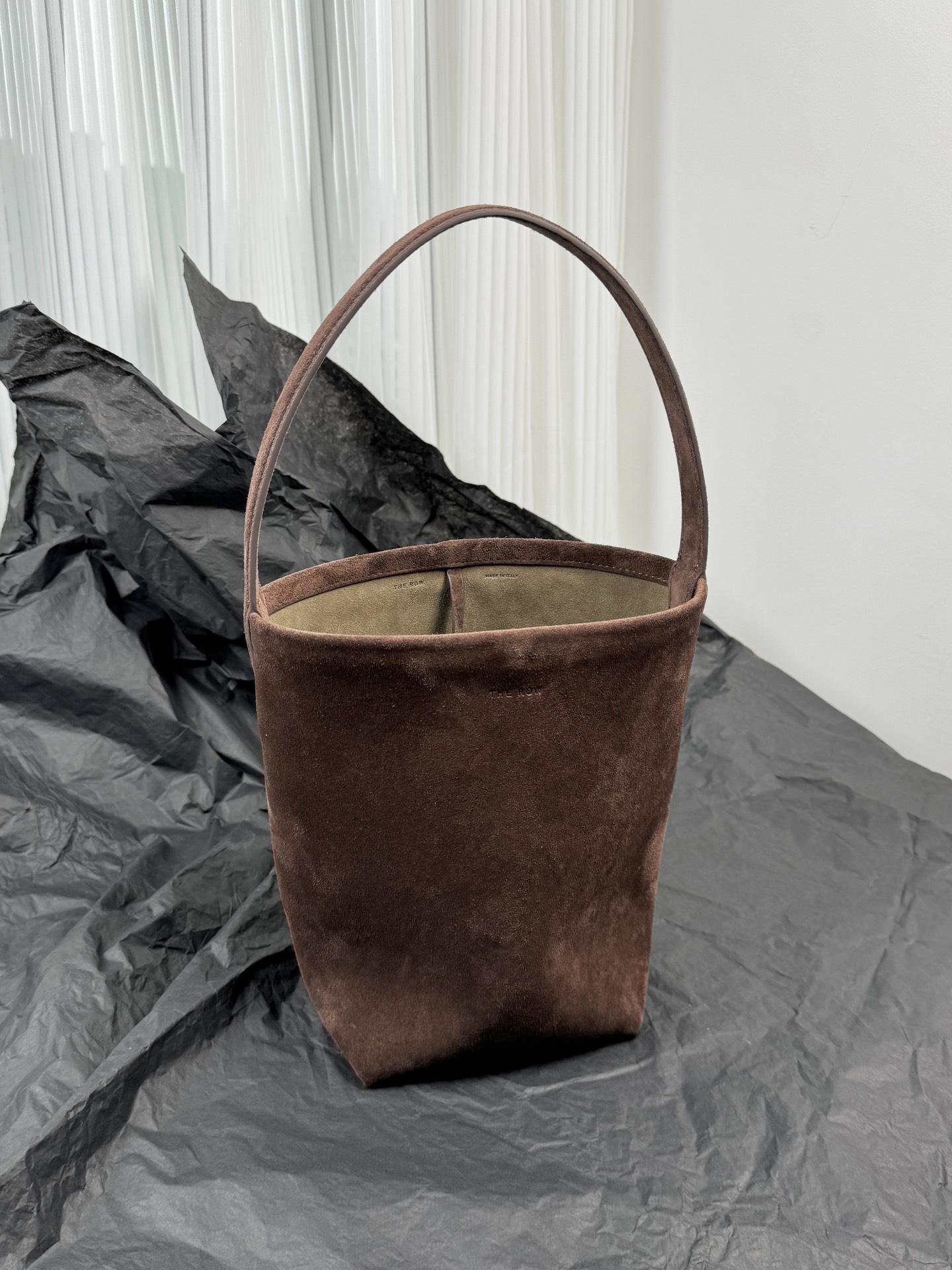 The Row suede bucket bag drawstring shoulder bag