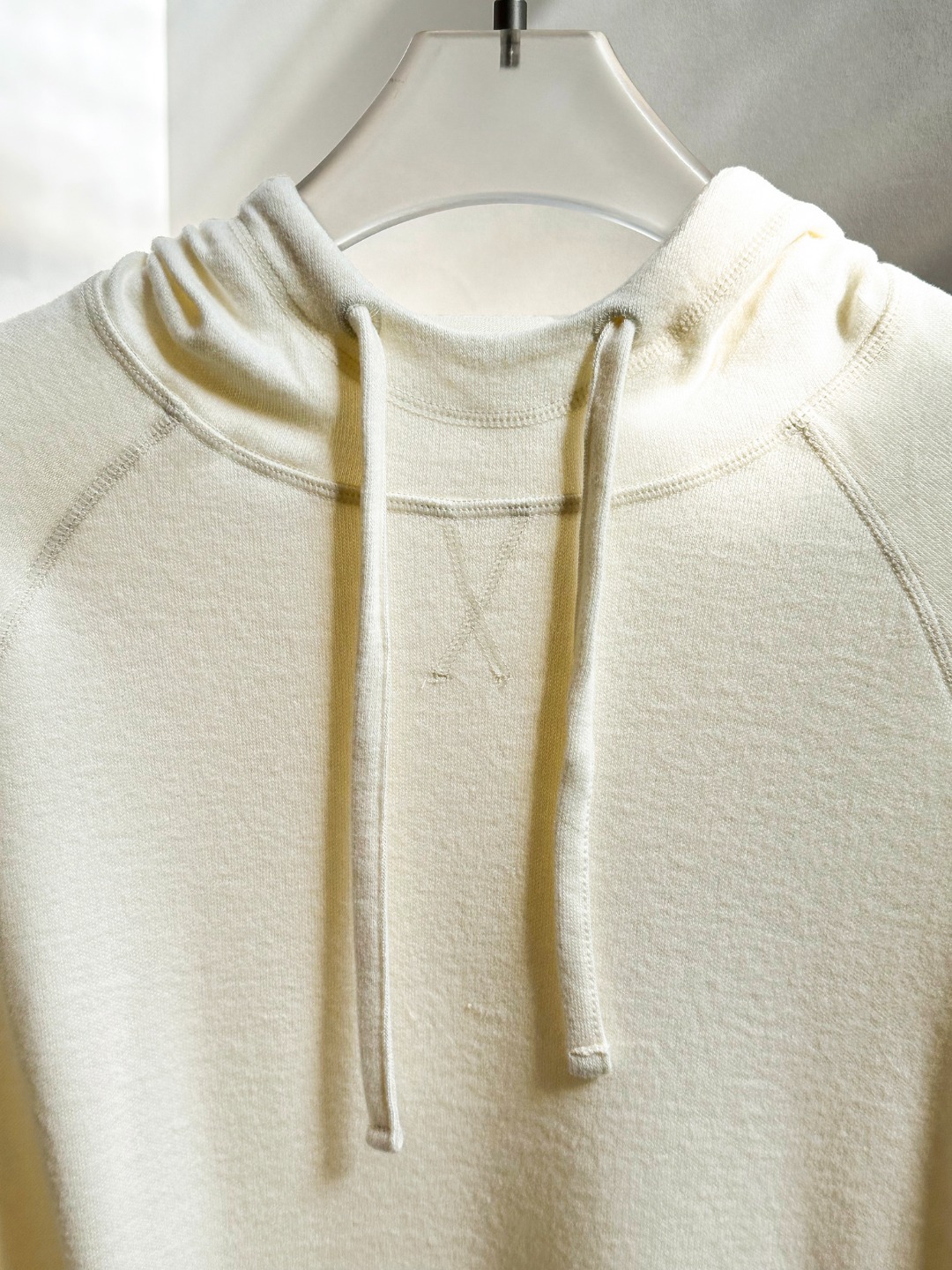 Hooded design that visually softens the shoulder line. - Comprehensive 8