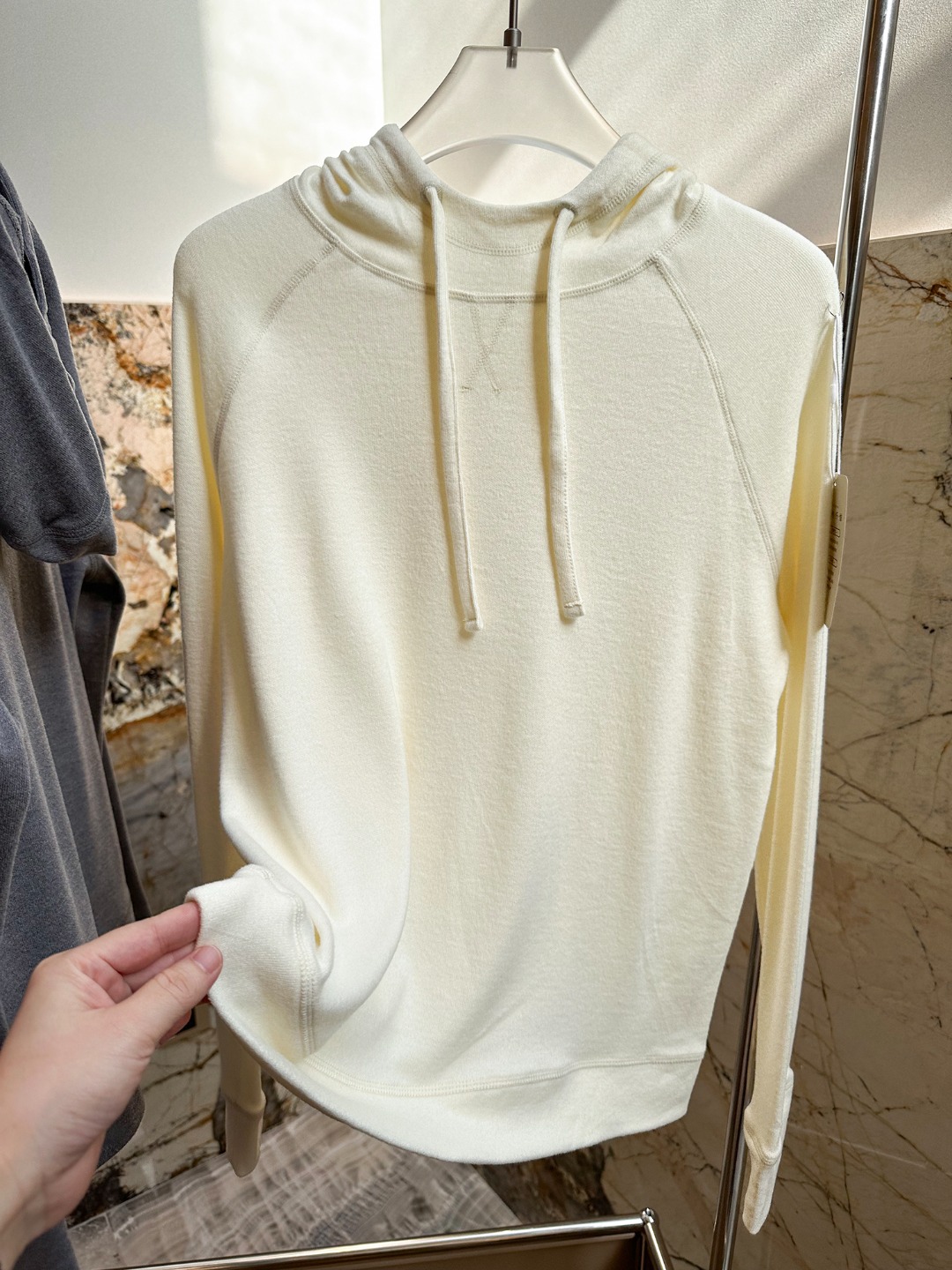 Hooded design that visually softens the shoulder line. - Comprehensive 7