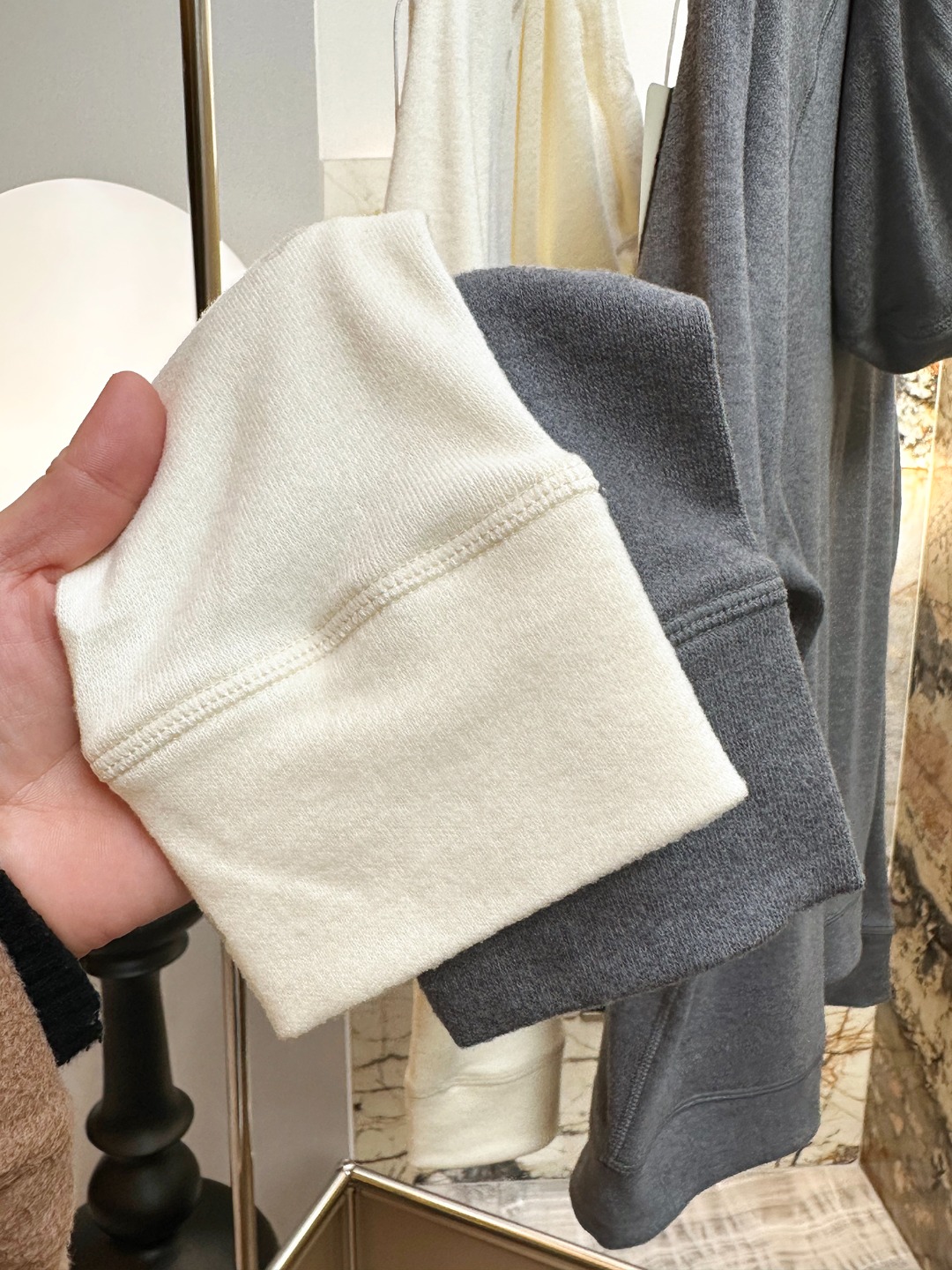 Hooded design that visually softens the shoulder line. - Comprehensive 9