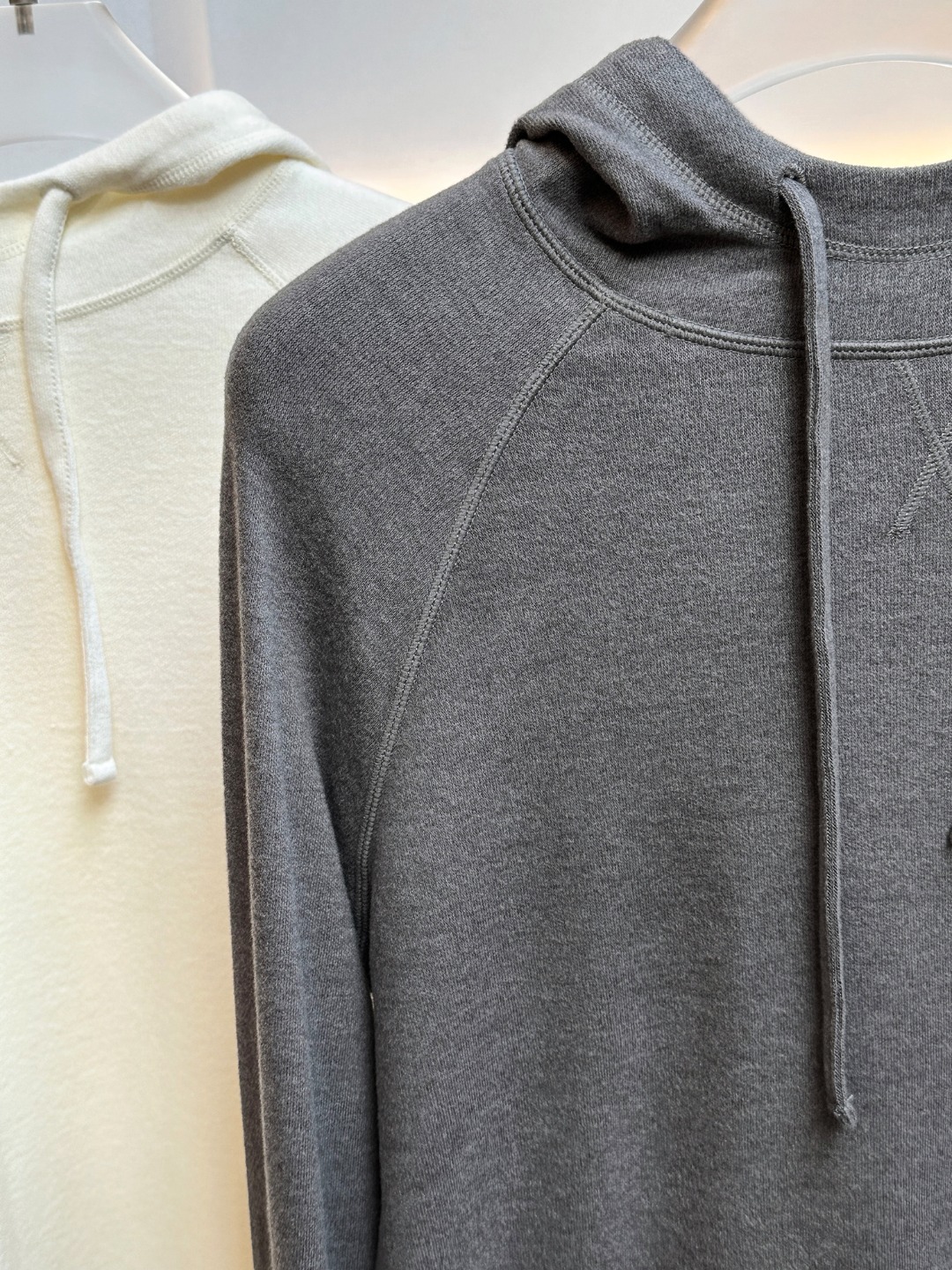 Hooded design that visually softens the shoulder line. - Comprehensive 5