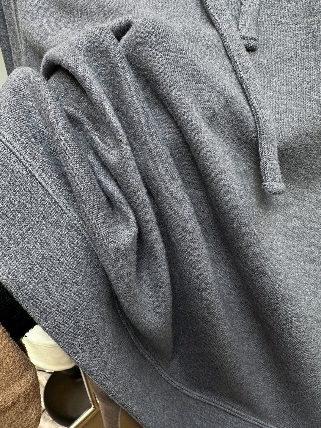 Hooded design that visually softens the shoulder line. - Comprehensive 6