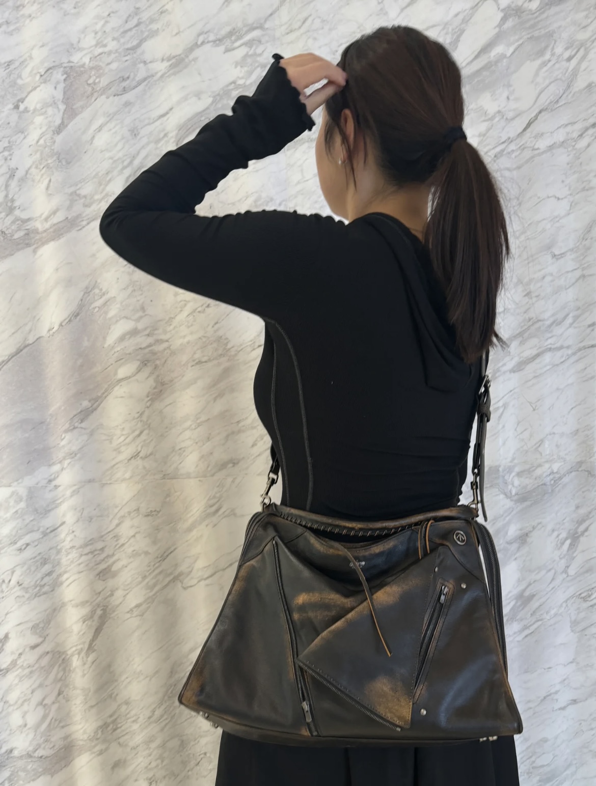 GROTTO, the contemporary designer label, presents its signature Hobo bag - Comprehensive 3