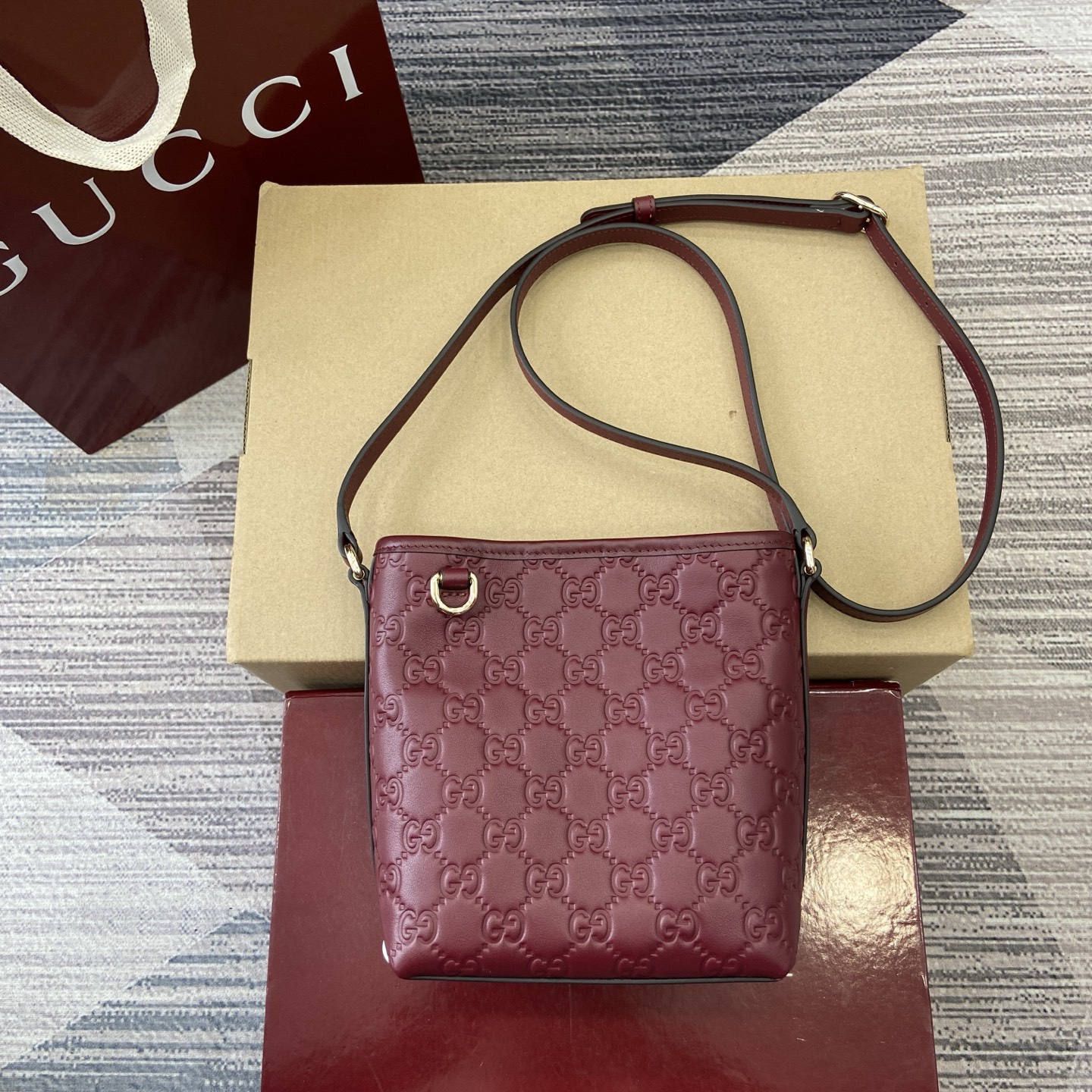 Gucci Emblem Mini Bucket Bag in Red Embossed Leather, Adjustable Strap