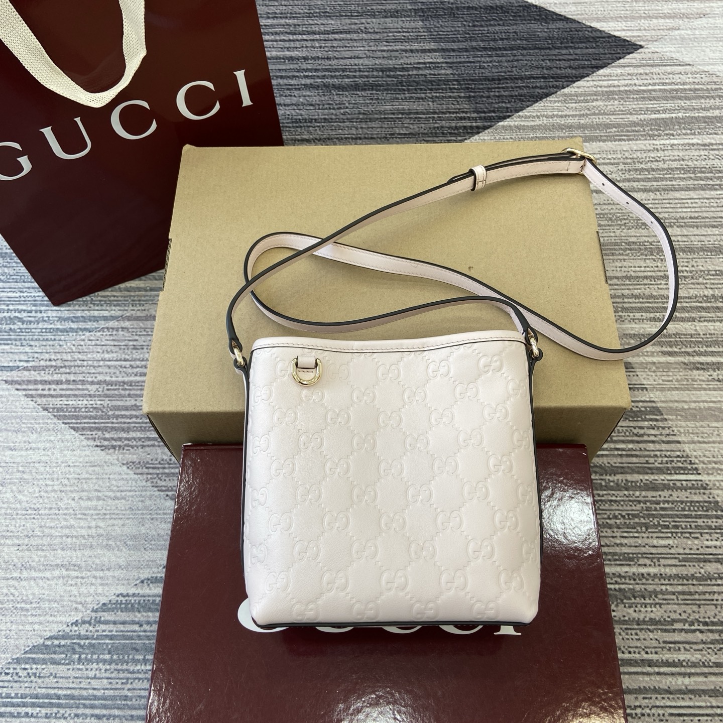 Gucci Emblem Mini Bucket Bag Light Pink Gucci Print Embossed Leather 2 i1756271398857 9055 0 0