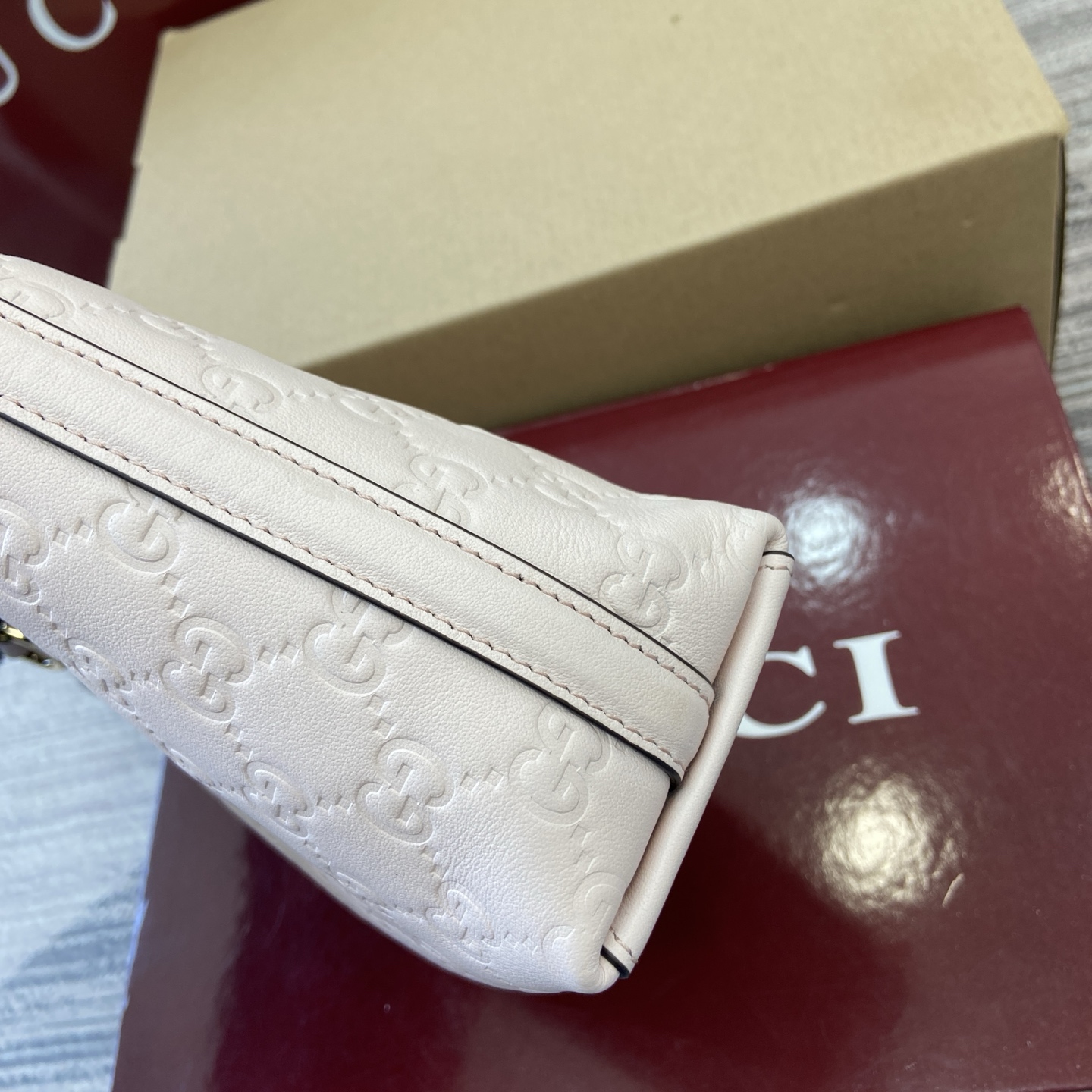 Gucci Emblem Mini Bucket Bag Light Pink Gucci Print Embossed Leather 11 i1756271398975 9474 0 9
