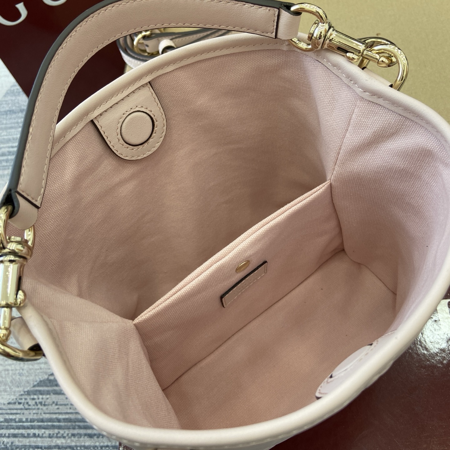 Gucci Emblem Embossed Leather Bucket Bag with Adjustable Strap, Light Pink 9 i1756271405802 4532 0 8