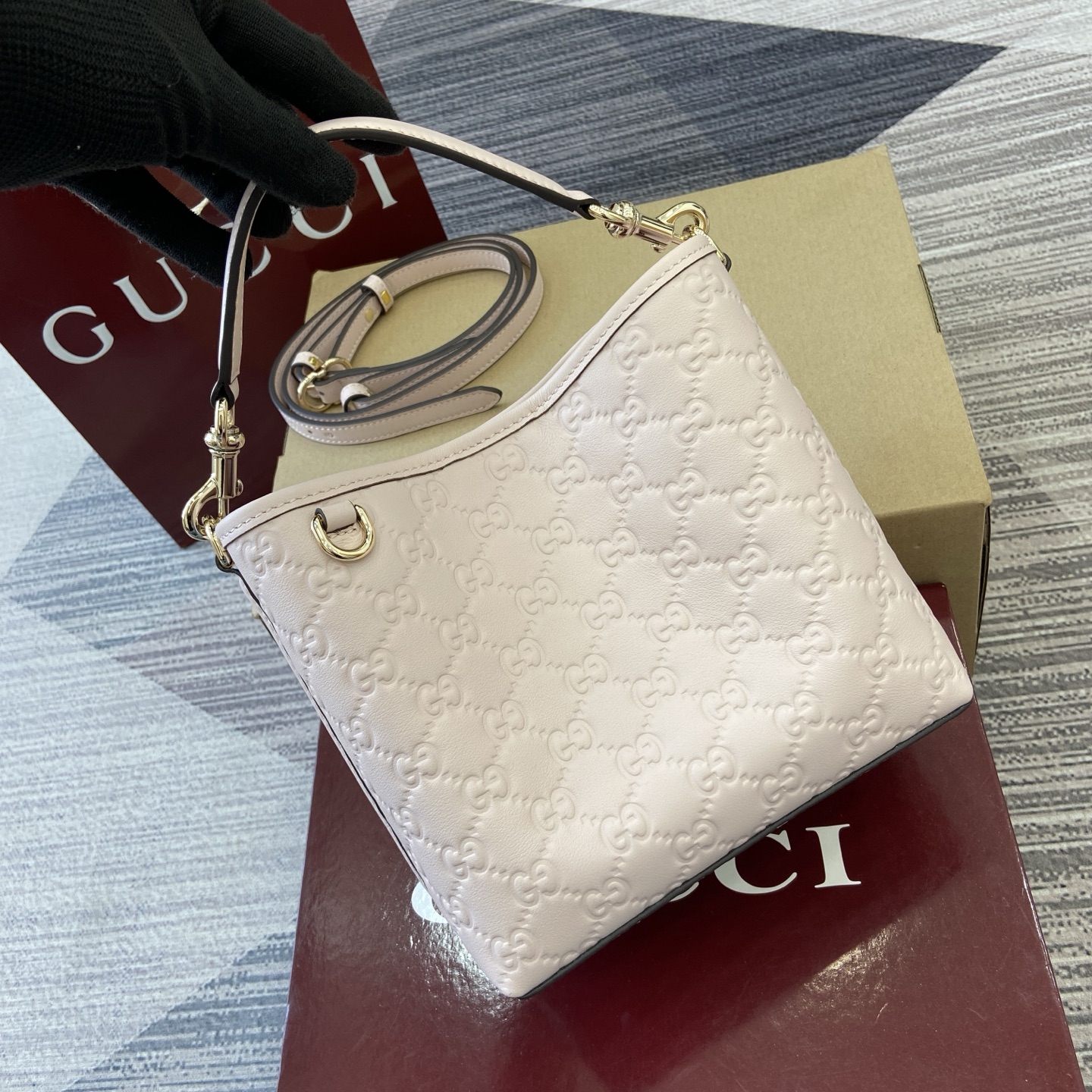 Gucci Emblem Embossed Leather Bucket Bag with Adjustable Strap, Light Pink 1 i1756271405819 5155 0 5