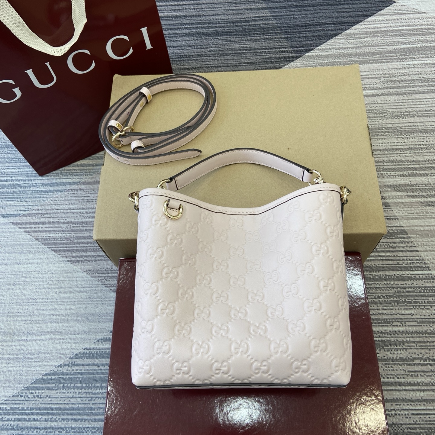 Gucci Emblem Embossed Leather Bucket Bag with Adjustable Strap, Light Pink 2 i1756271410688 3279 0 0