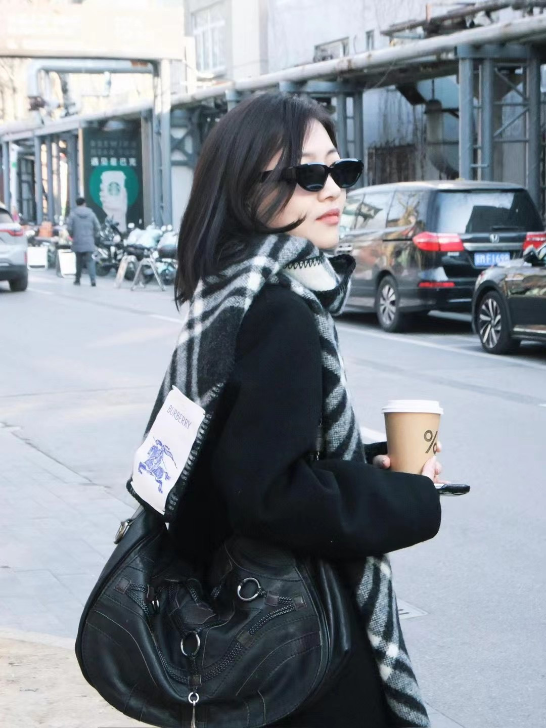A versatile scarf featuring a classic check motif, designed for - Comprehensive 7