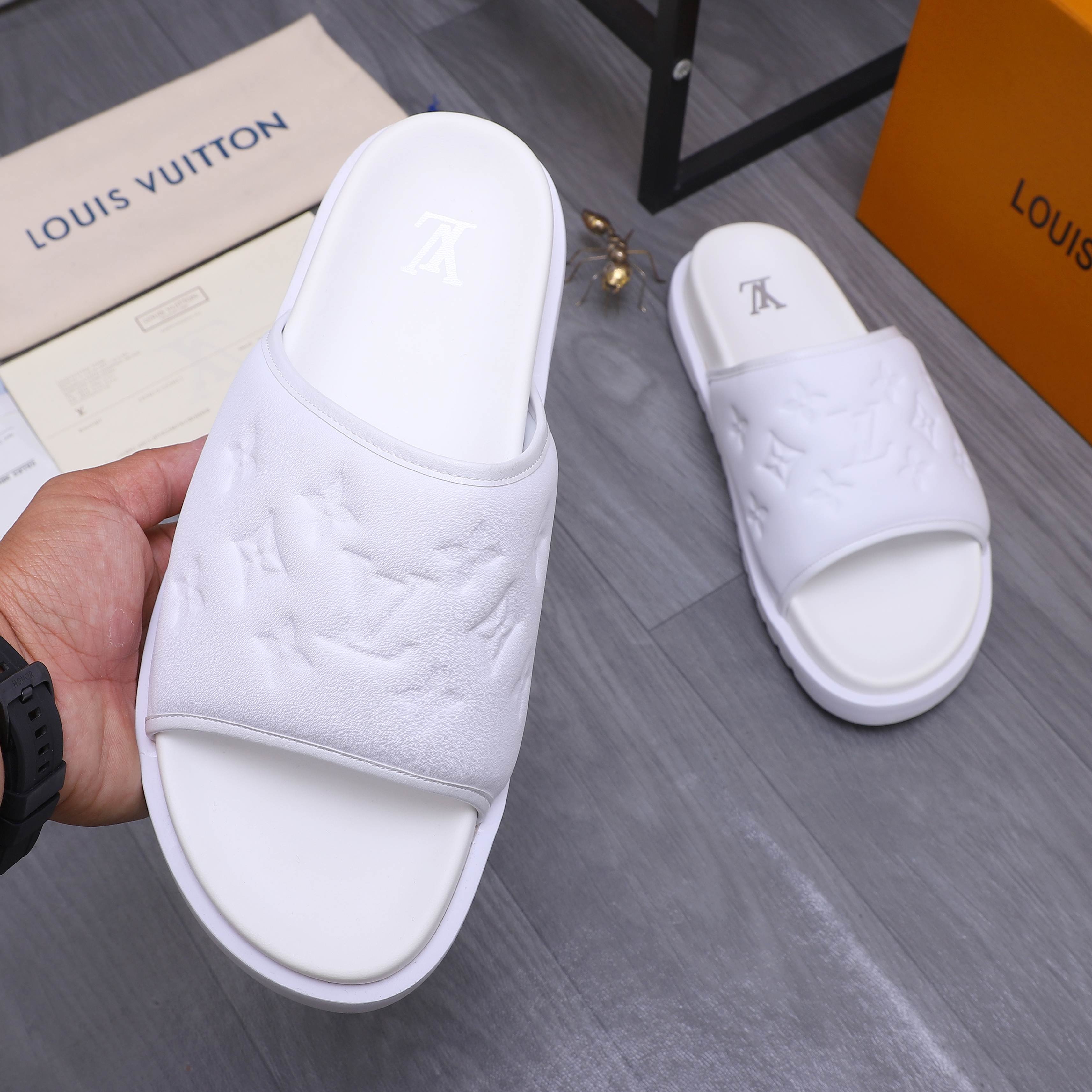 Louis Vuitton Men's Classic Embossed Leather Slides Sandals, Multiple Colors 6 a1744769799646 8685