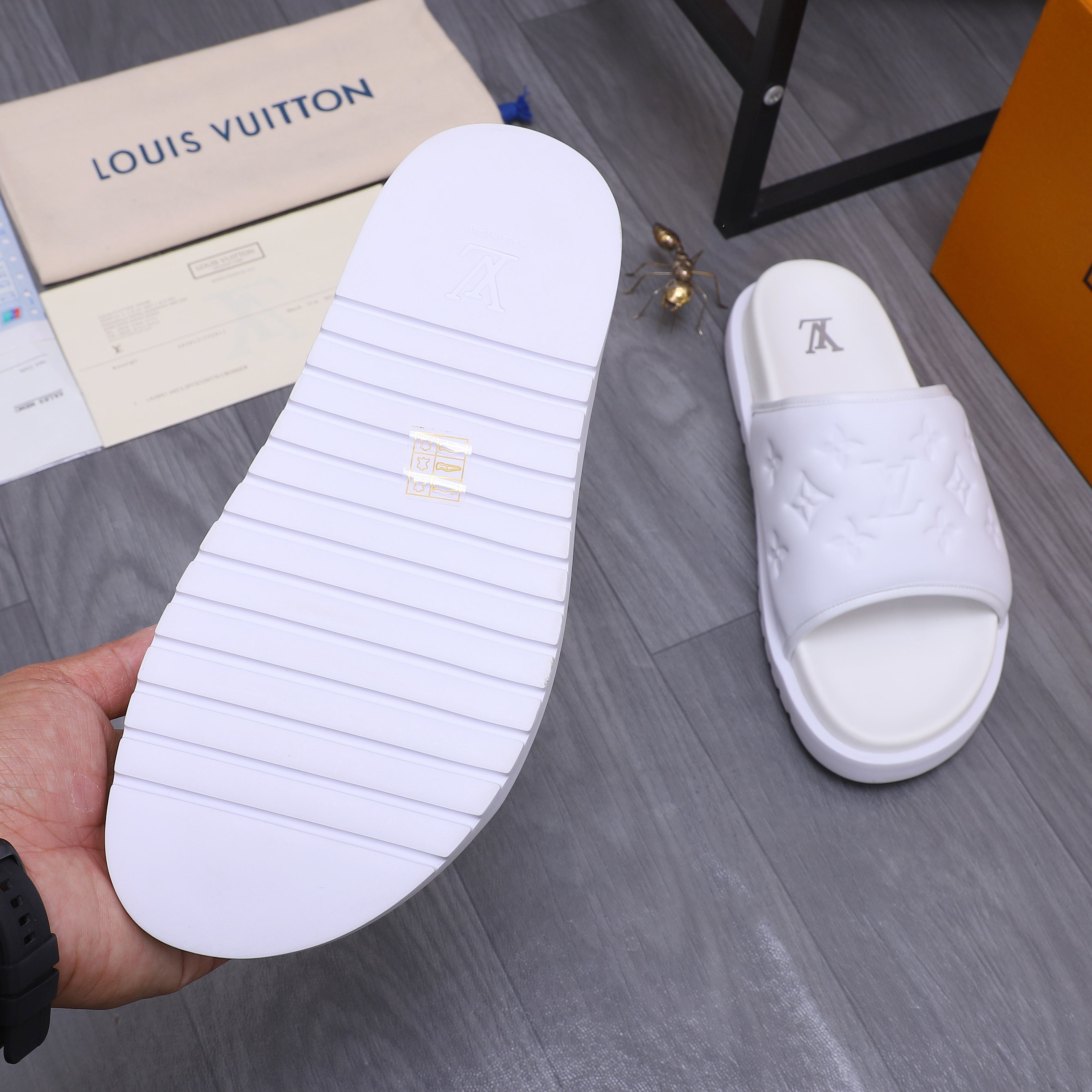Louis Vuitton Men's Classic Embossed Leather Slides Sandals, Multiple Colors 9 a1744769801708 8713