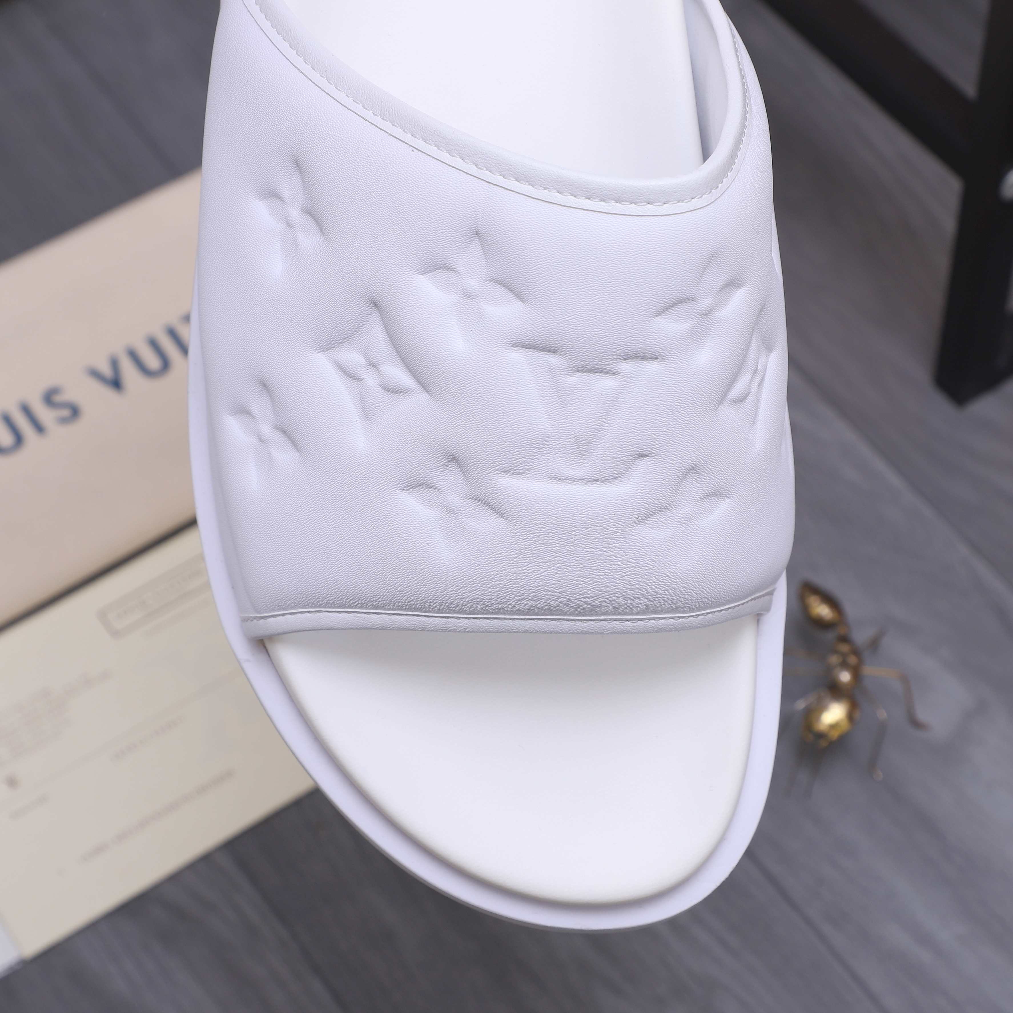Louis Vuitton Men's Classic Embossed Leather Slides Sandals, Multiple Colors 10 a1744769802122 0477