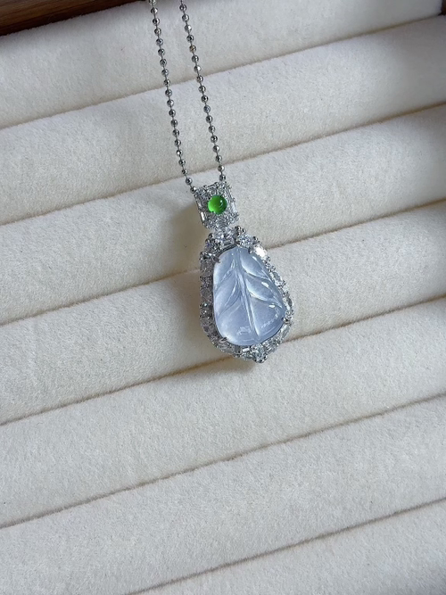 Silver-encased natural light photo: Icy, radiant leaf pendant