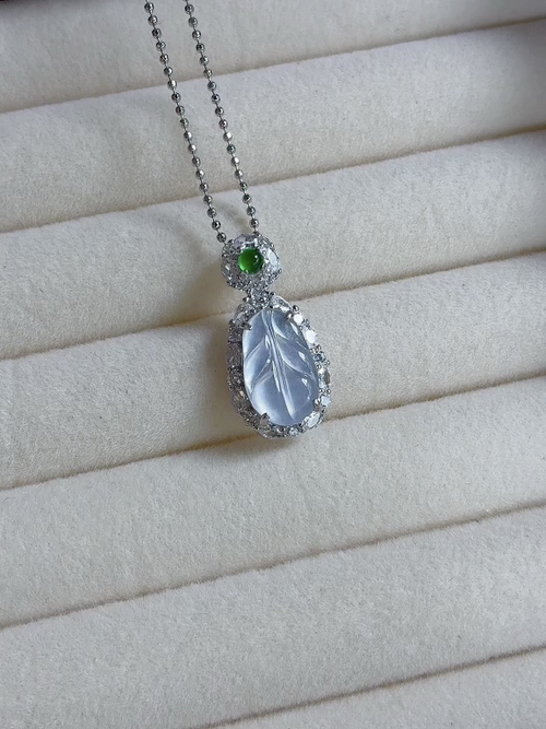 Silver-encased natural light photo: Icy, radiant leaf pendant