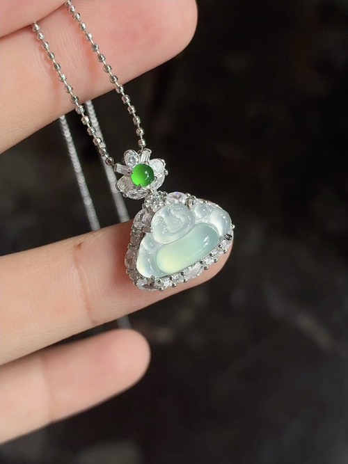 Silver-set natural light photo: icy translucent with sparkling gold and green silk-like inclusions, Buddha pendant