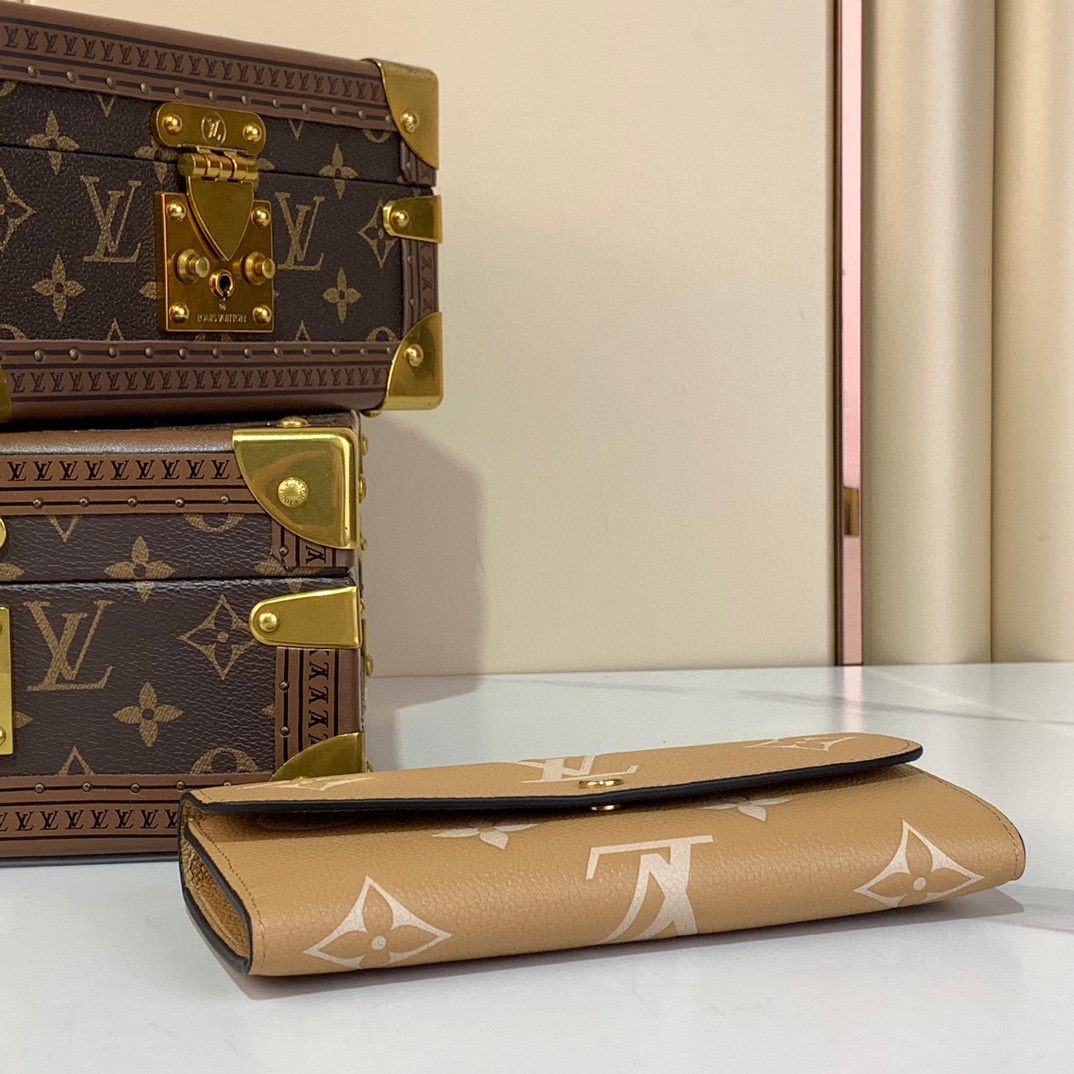 Louis Vuitton Emilie Wallet Monogram Empreinte Leather Apricot 6 i1731933866 8760 8