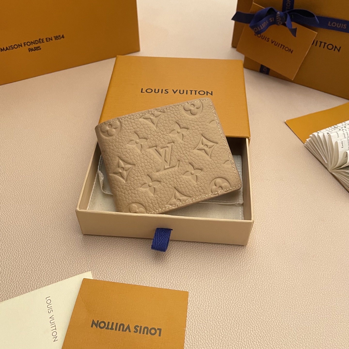Louis Vuitton Multiple Wallet Taurillon Leather Khaki Monogram Embossed 1 i1743595423516 381 0 0
