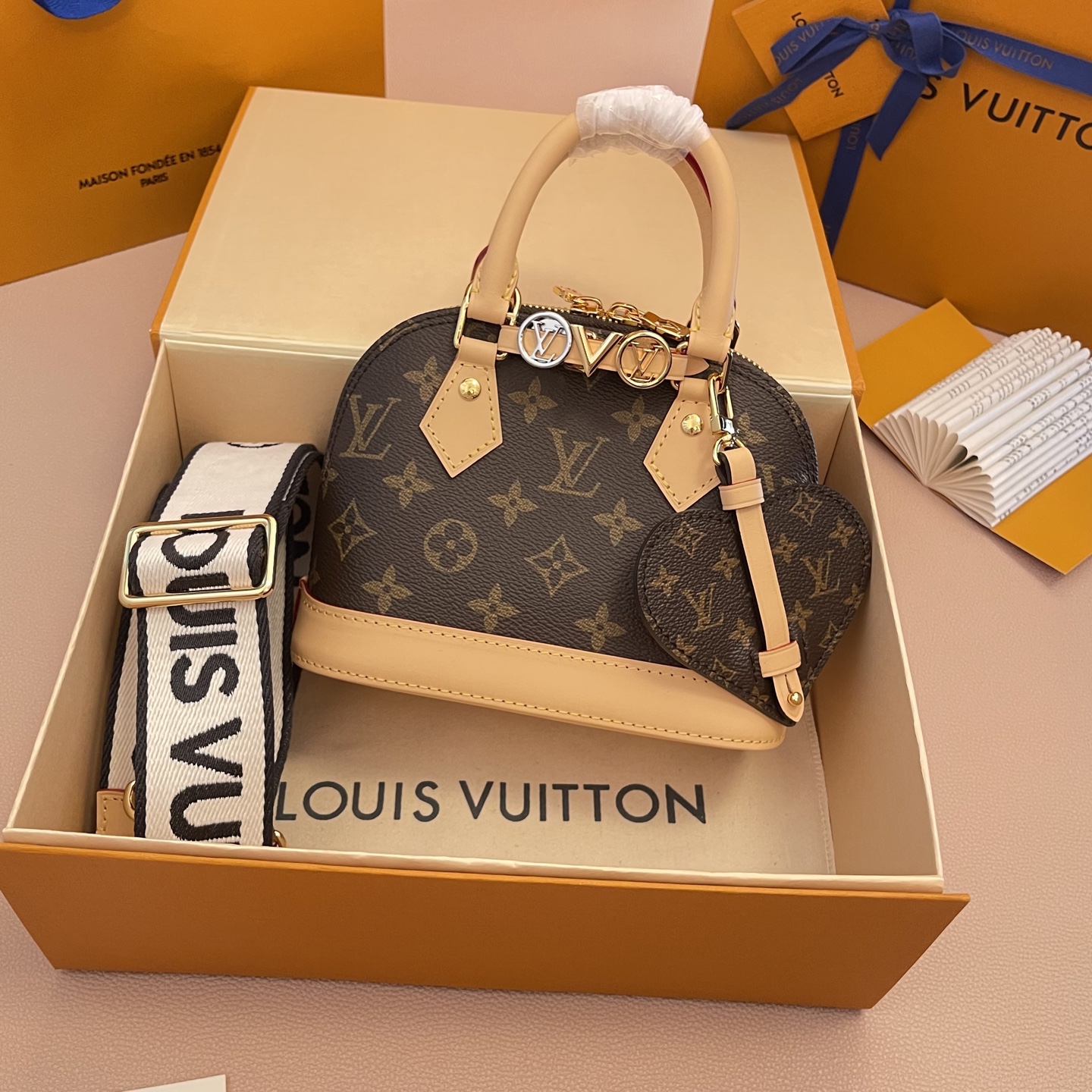 Louis Vuitton Alma Mini Monogram Canvas with Charms and Heart Coin Purse 1 i1754819113357 8858 0 0