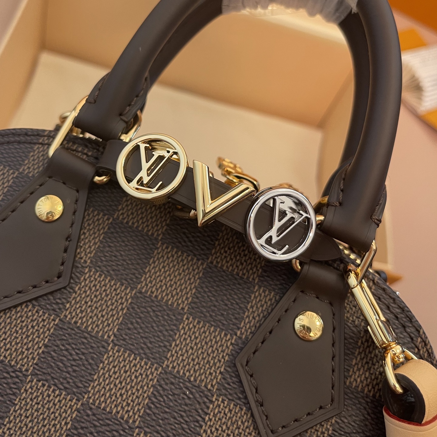 Louis Vuitton Alma Mini Handbag Damier Ebene Canvas with Heart Bag Charm 4 i1754914137493 6455 0 2