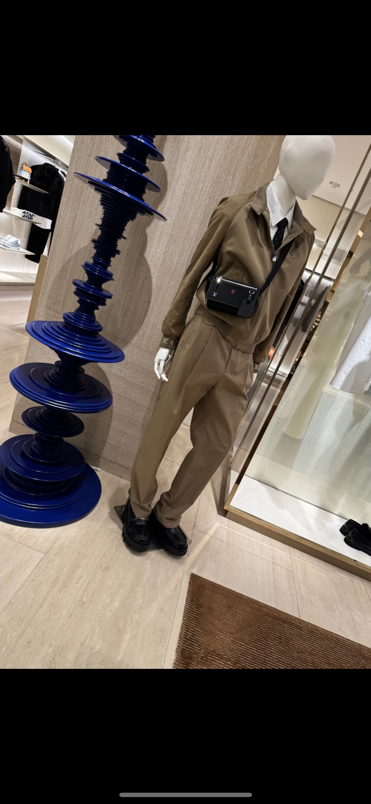 Louis Vuitton Men's Brown Suit with Black Leather Crossbody Bag