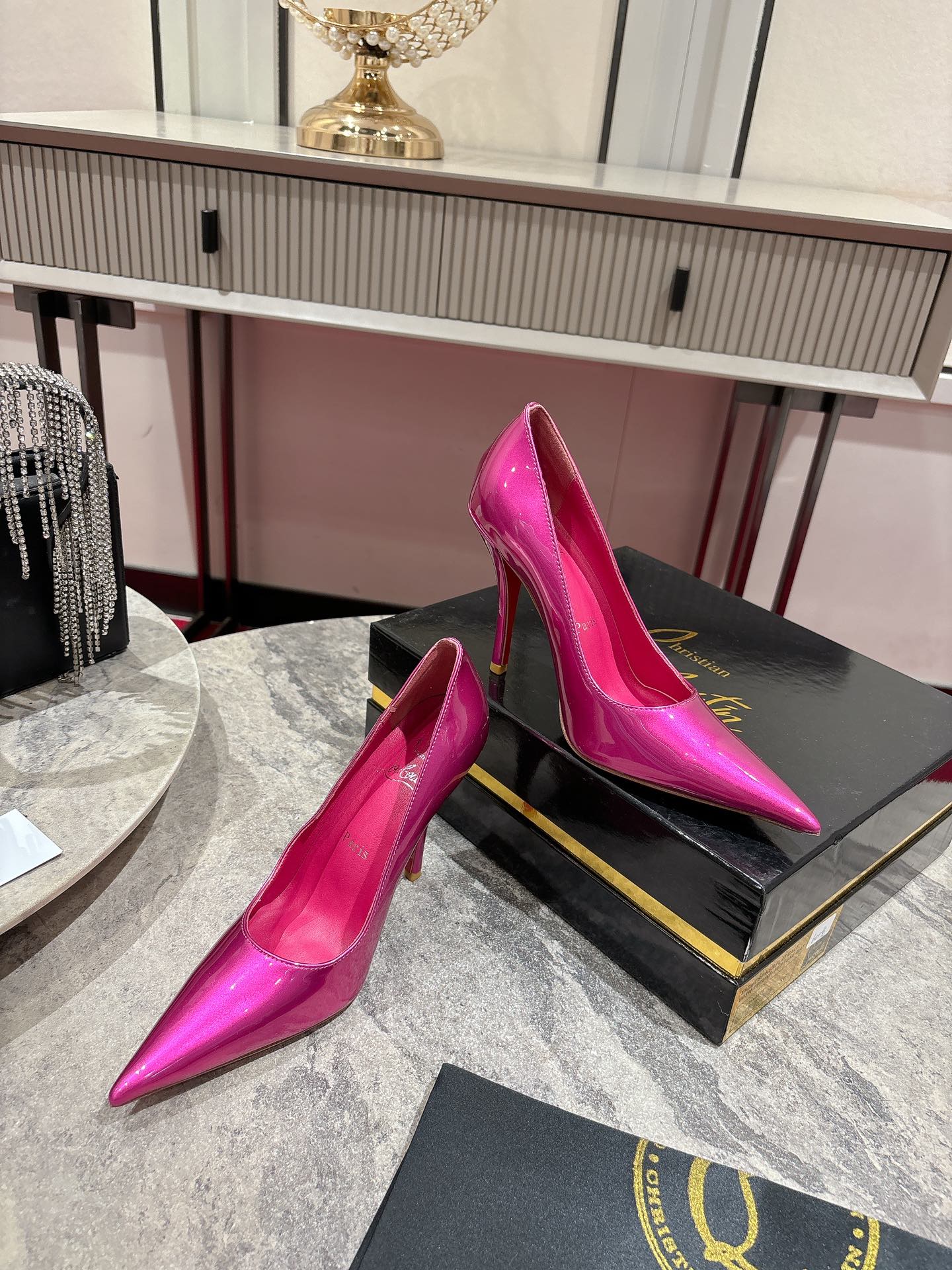 Louboutin Everlasting Red Heel Shoe with Innovative Coating for Durability.