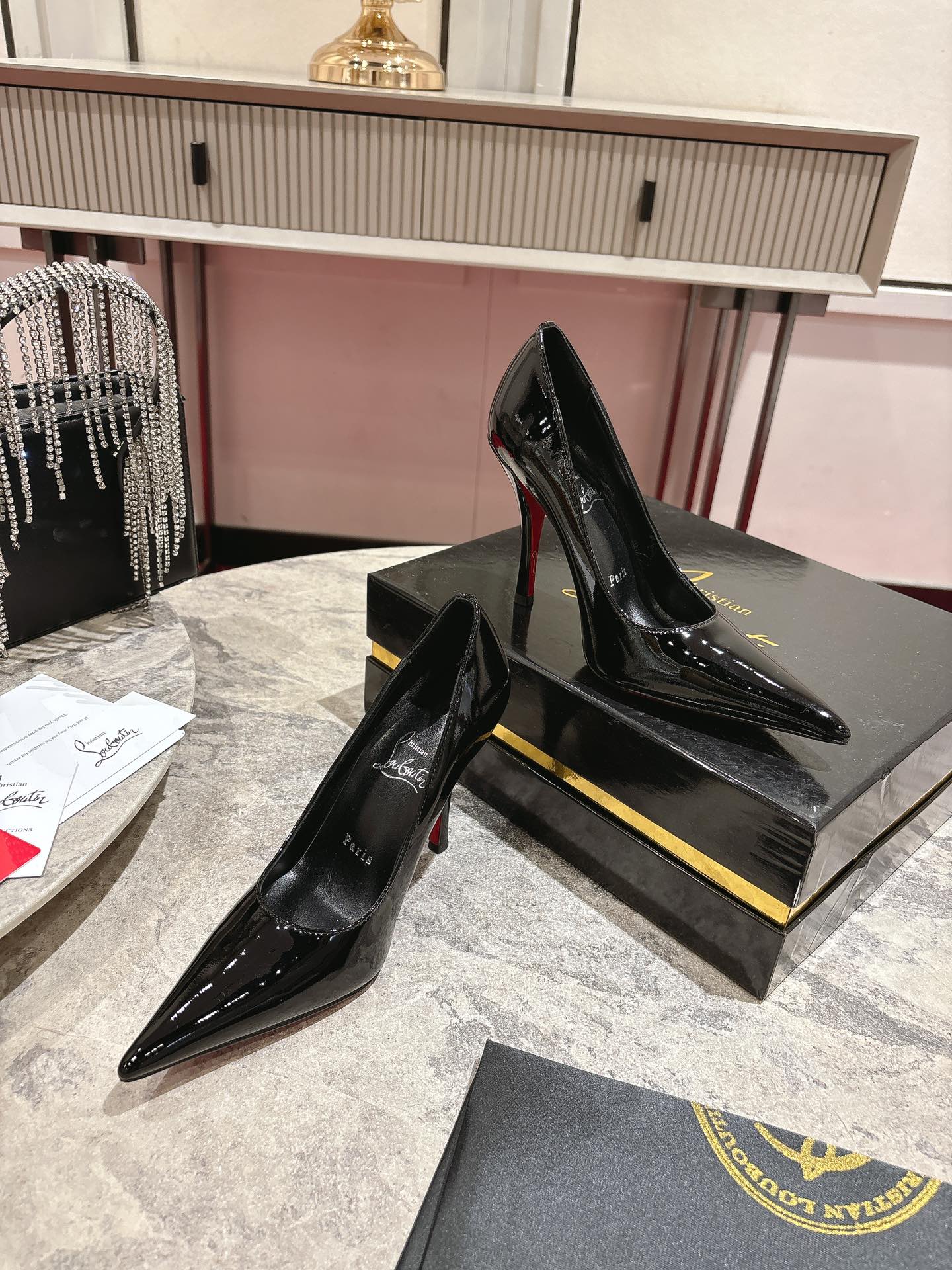 Iconic Louboutin Red Heeled Shoe: Innovative Design for Durability and Style
