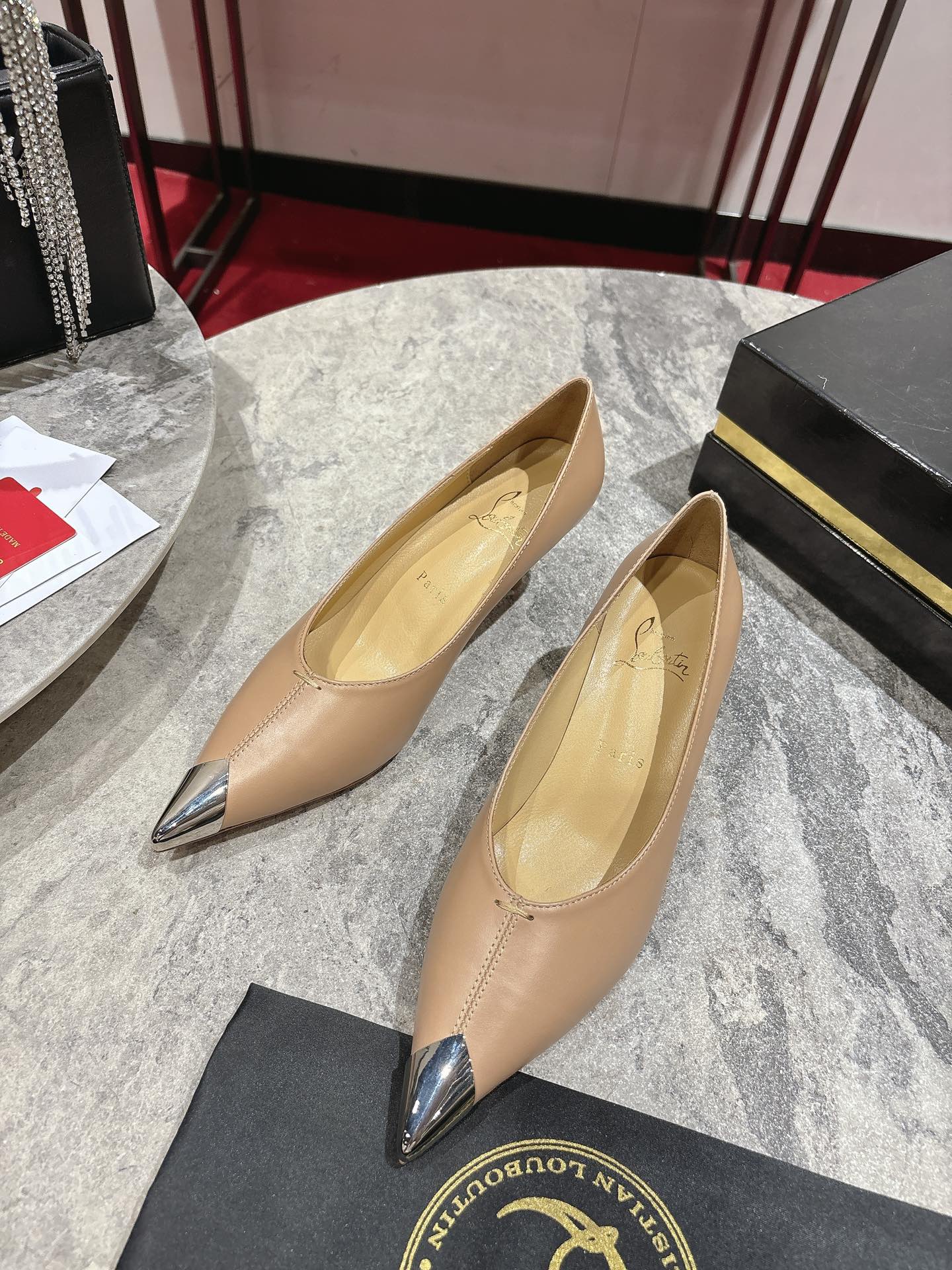 Title: Louboutin Everlasting Red Shoe with 5.5mm Heel Summary: Iconic black Louboutin shoe with durable “Everlasting Red” base, silver hardware,