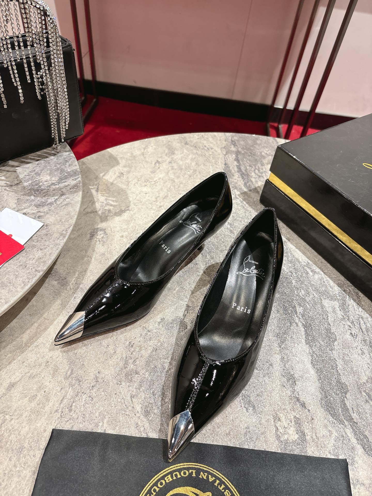 “Iconic Louboutin Everlasting Red Shoe with Durable Coating Technique”