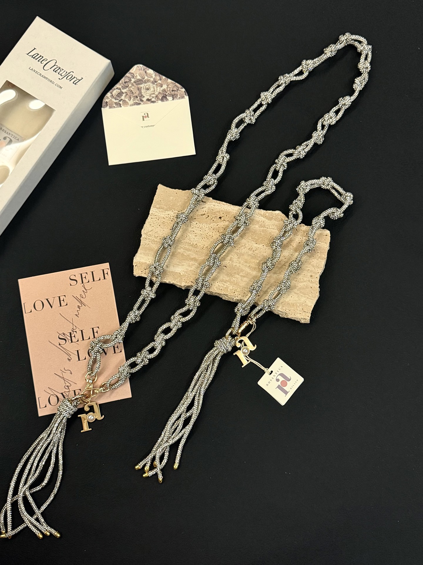 NO:919152,Silver｜Cool silver glitter Universal all-match diamond mobile phone lanyard Rosantica classic silver mobile phone chain Bag charm Hand-woven with transparent silver glitter rice beads Classic knotted chain + smart tassel Low-key but with a fine glitter and high-end feel Don’t choose outfits or phone case colors Hold it all for commuting | dating | dinner parties Detachable design, can also be used as a bracelet or small bag charm Exquisite small accessories that can be used all year round, durable and timeless  #Rosantica #silver accessories # versatile mobile phone chain #Exquisite good things Cool broken silver timeless universal mobile phone lanyard Low-key and high-end | Daily commuting natal mobile phone chain, bracelet, phone cases19860909银色｜清冷银闪 万能百搭款闪钻手机挂绳 Rosantica经典银色手机链 包包挂饰 通透银闪米珠手工编织而成 经典打结链型+灵动流苏 低调却自带细闪高级感 不挑穿搭、不挑手机壳颜色 通勤｜约会｜晚宴全部hold住 可拆卸设计,也可当做手链、小包挂饰 一年四季都能用的精致小配饰,耐看永不过时 #Rosantica #银色配饰 #百搭手机链 #精致好物 清冷碎银永不过时的万能手机挂绳 低调高级｜日常通勤本命手机链,,bracelet,phone cases,accessory