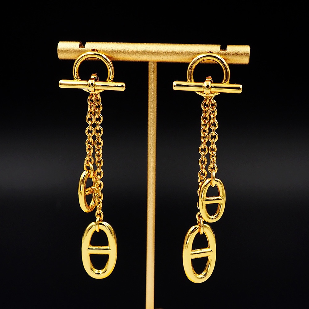 Boucles d'oreilles Hermes Reponse Farandole métal doré longueur goutte 4 5cm
