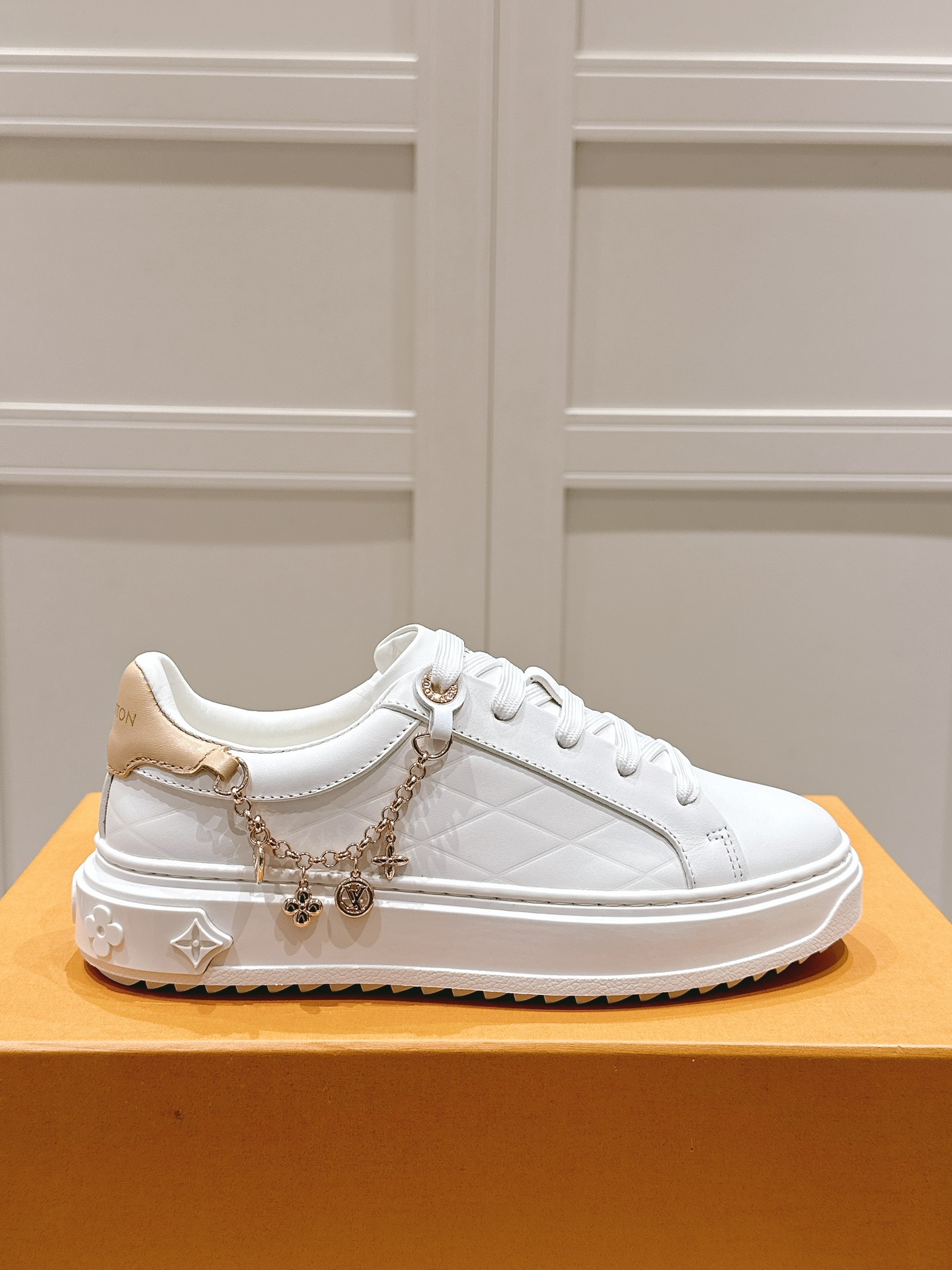 Louis Vuitton Women's White Leather Low-Top Sneakers with Charm Detail