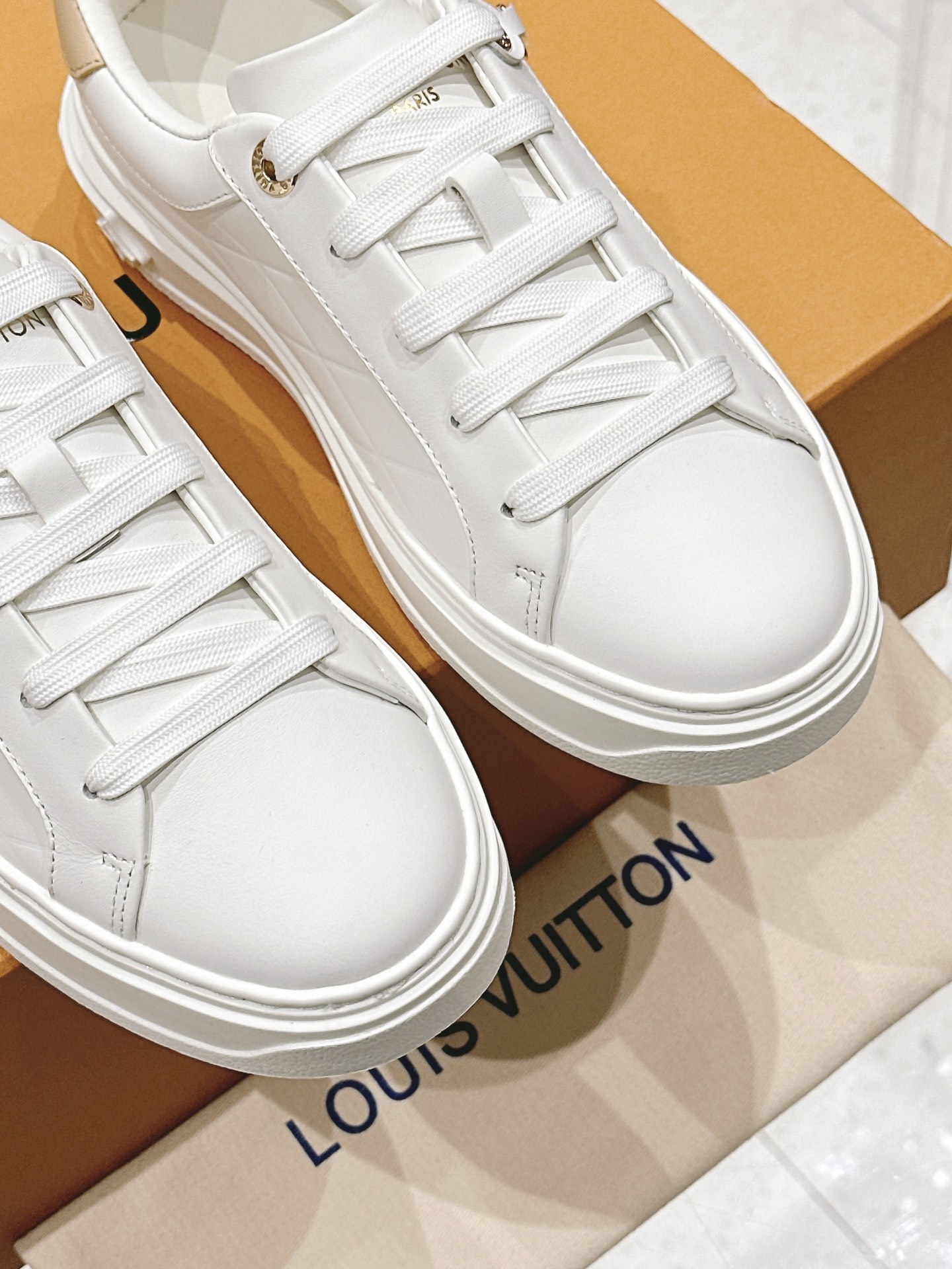 Louis Vuitton Women's White Leather Low-Top Sneakers with Charm Detail 7 i1728344964 3263 3
