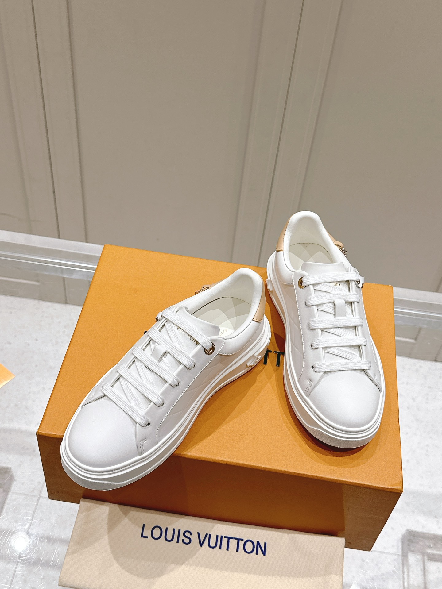 Louis Vuitton Women's White Leather Low-Top Sneakers with Charm Detail 6 i1728344964 4118 1