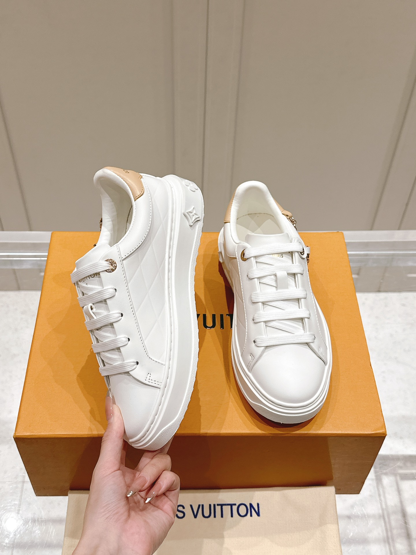 Louis Vuitton Women's White Leather Low-Top Sneakers with Charm Detail 5 i1728344964 5090 6